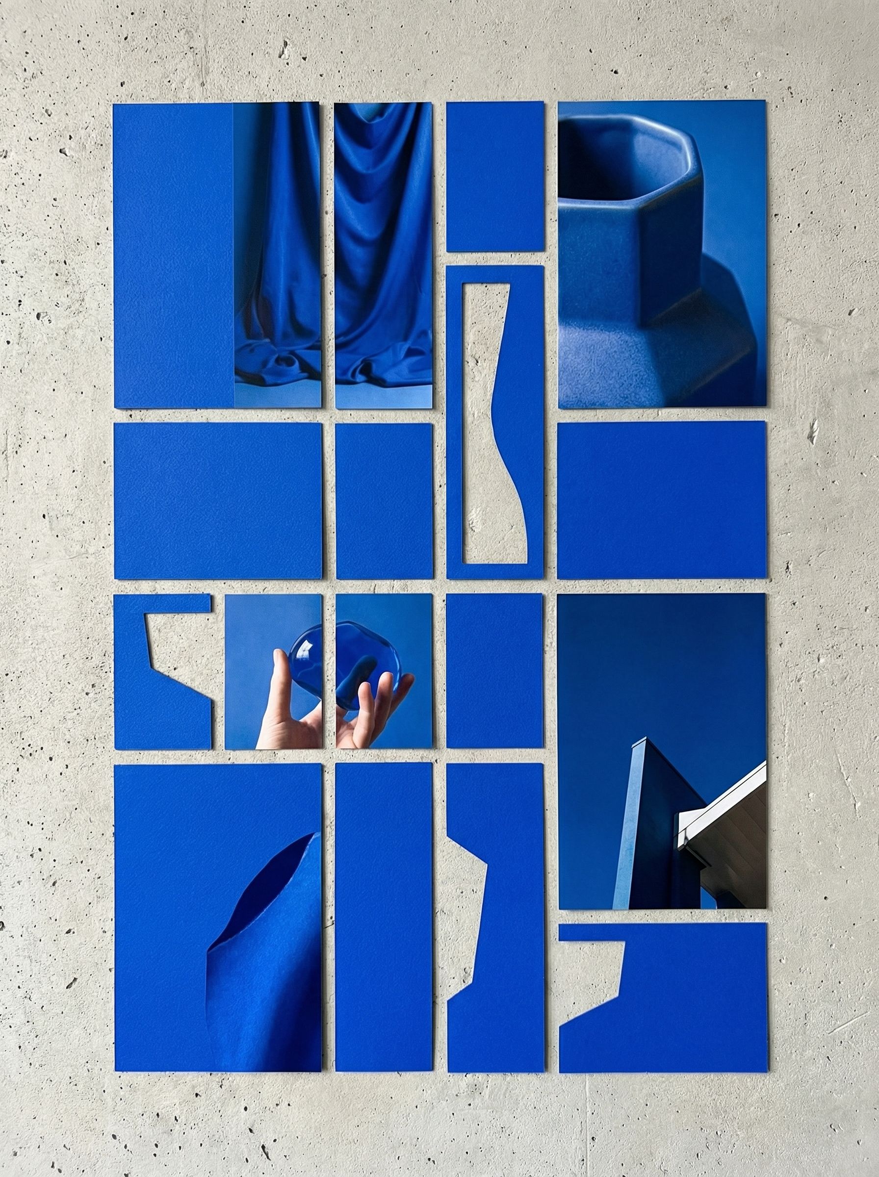 Abstract blue collage on concrete wall