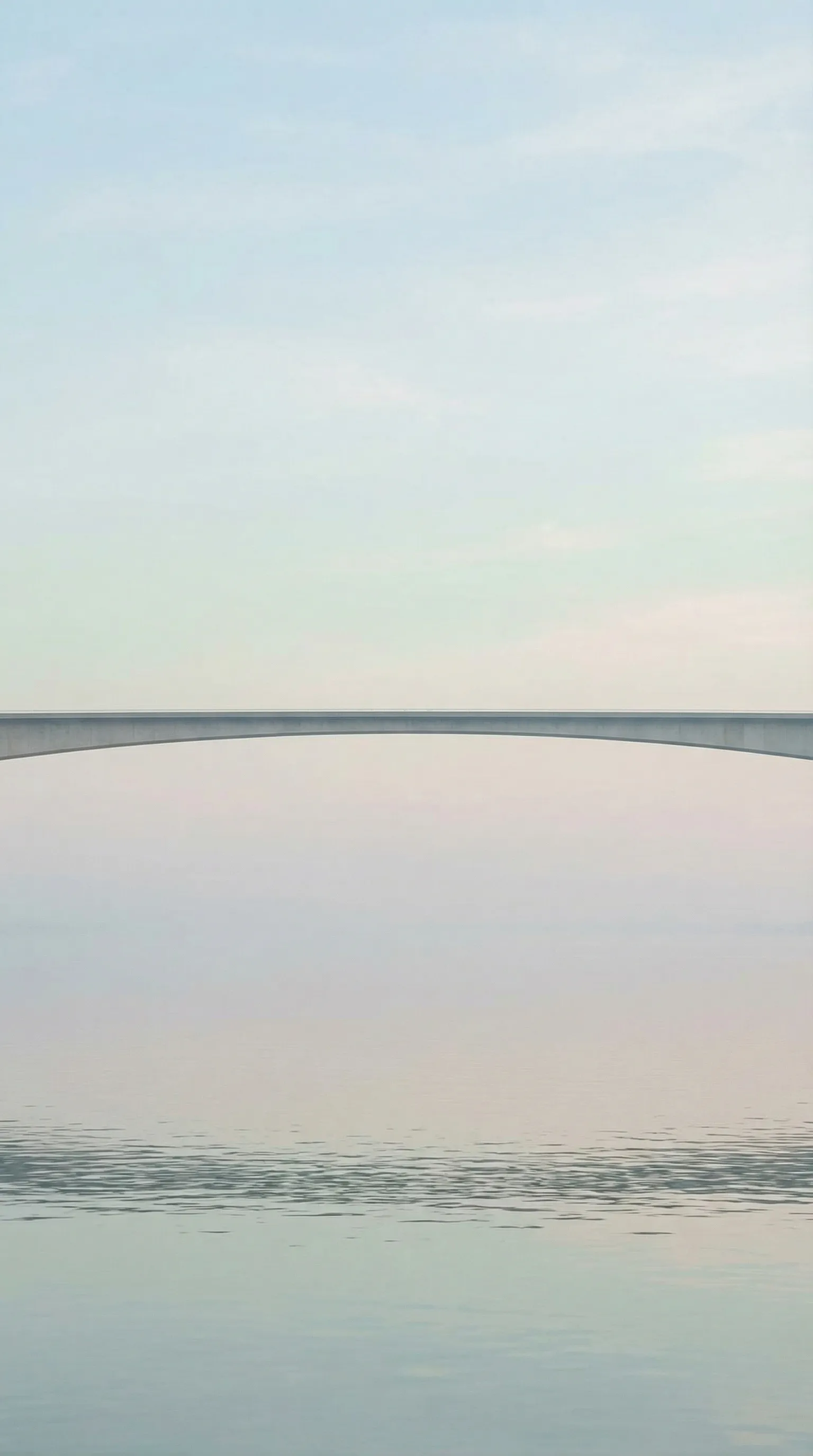 Minimal Bridge Over Calm Water at Dusk