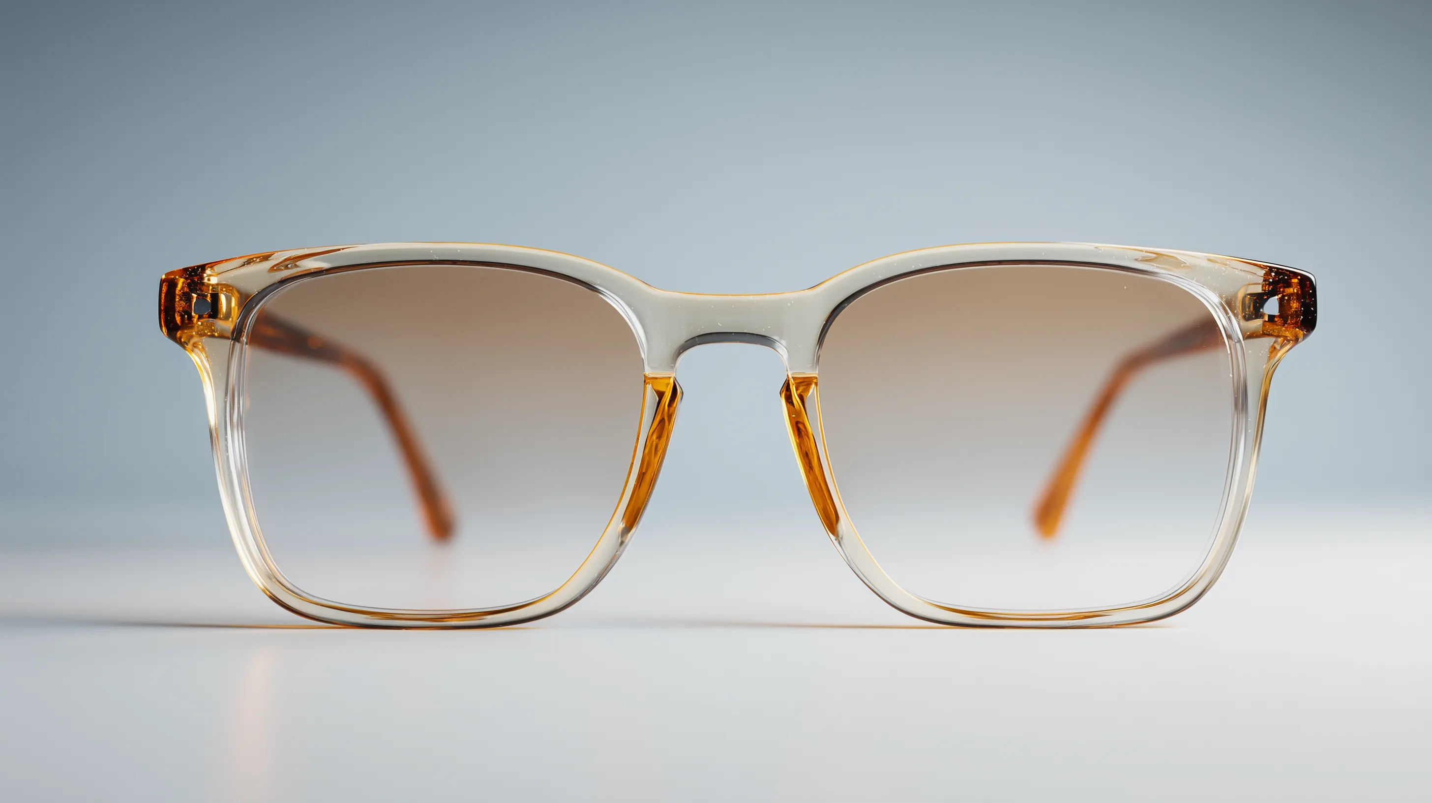 Close-up of stylish amber gradient sunglasses