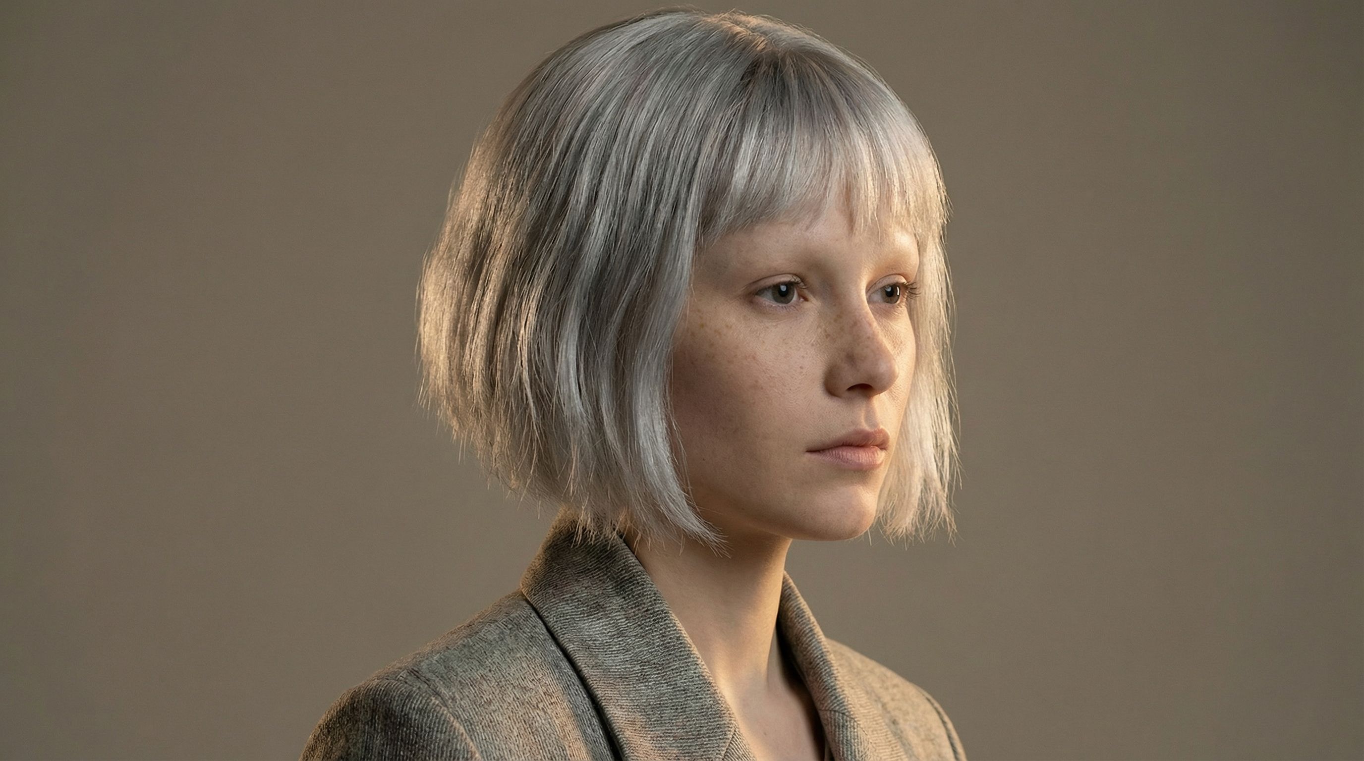 Studio portrait of person with silver bob hair