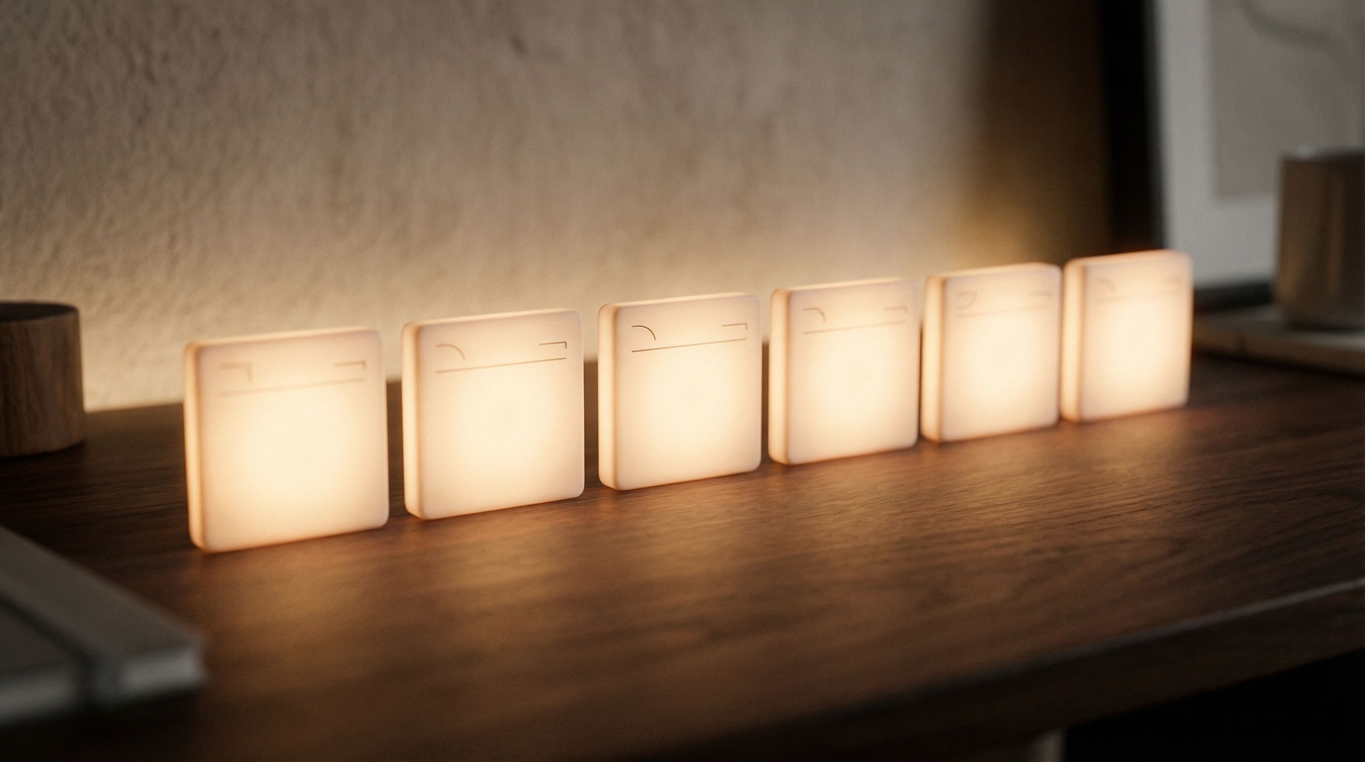 Row of warm square night lights on shelf