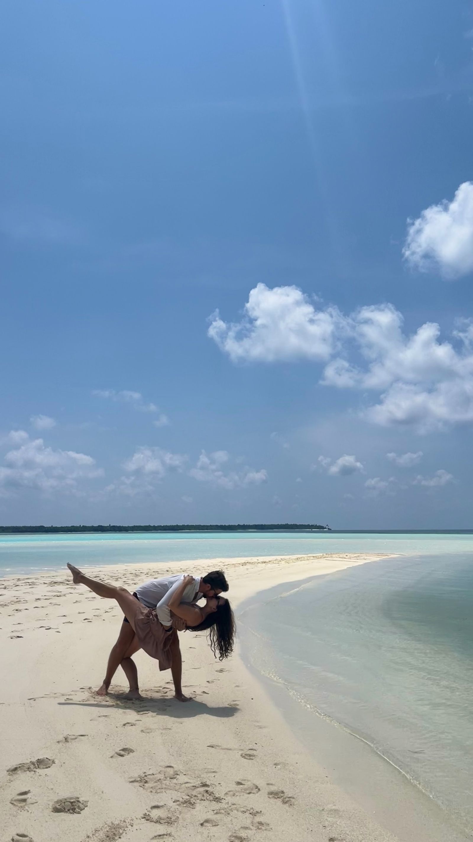 Couple Walking in Tropical Sandbar Lagoon