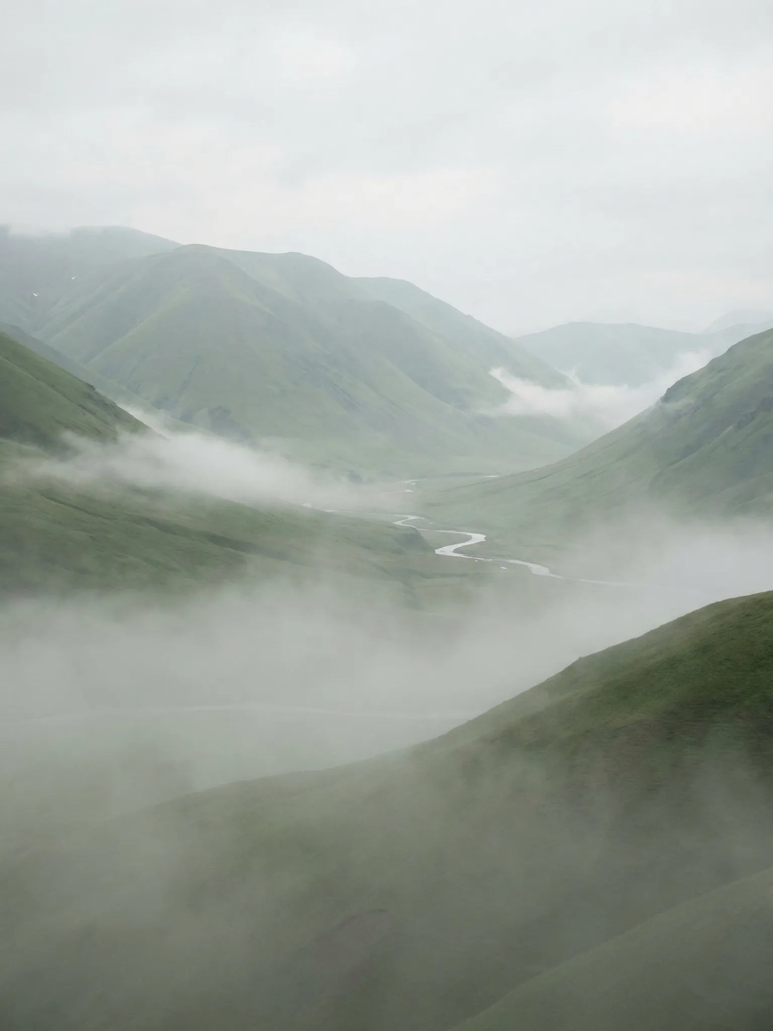 Misty Green Mountains with Winding River