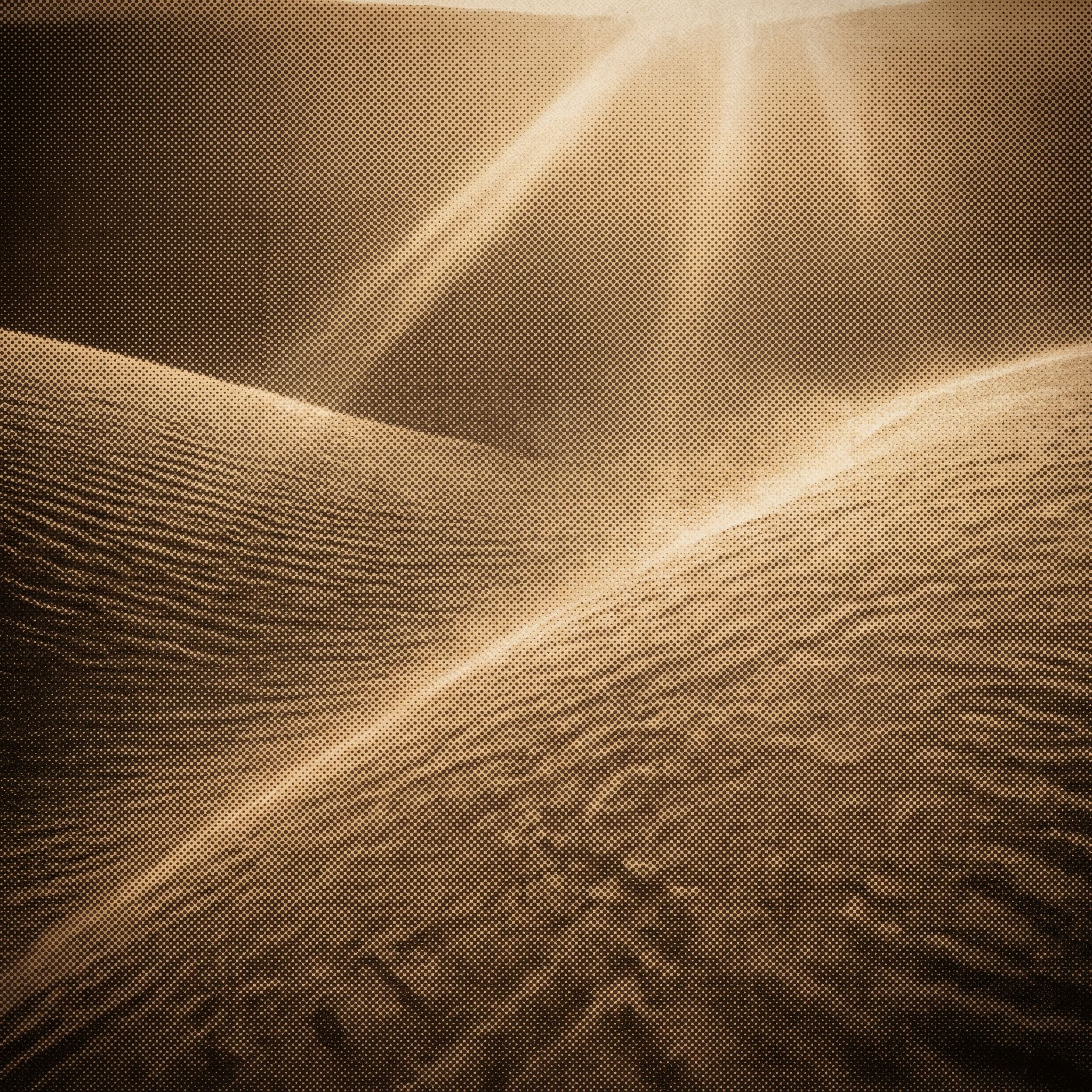 Sunlit desert dunes in halftone texture