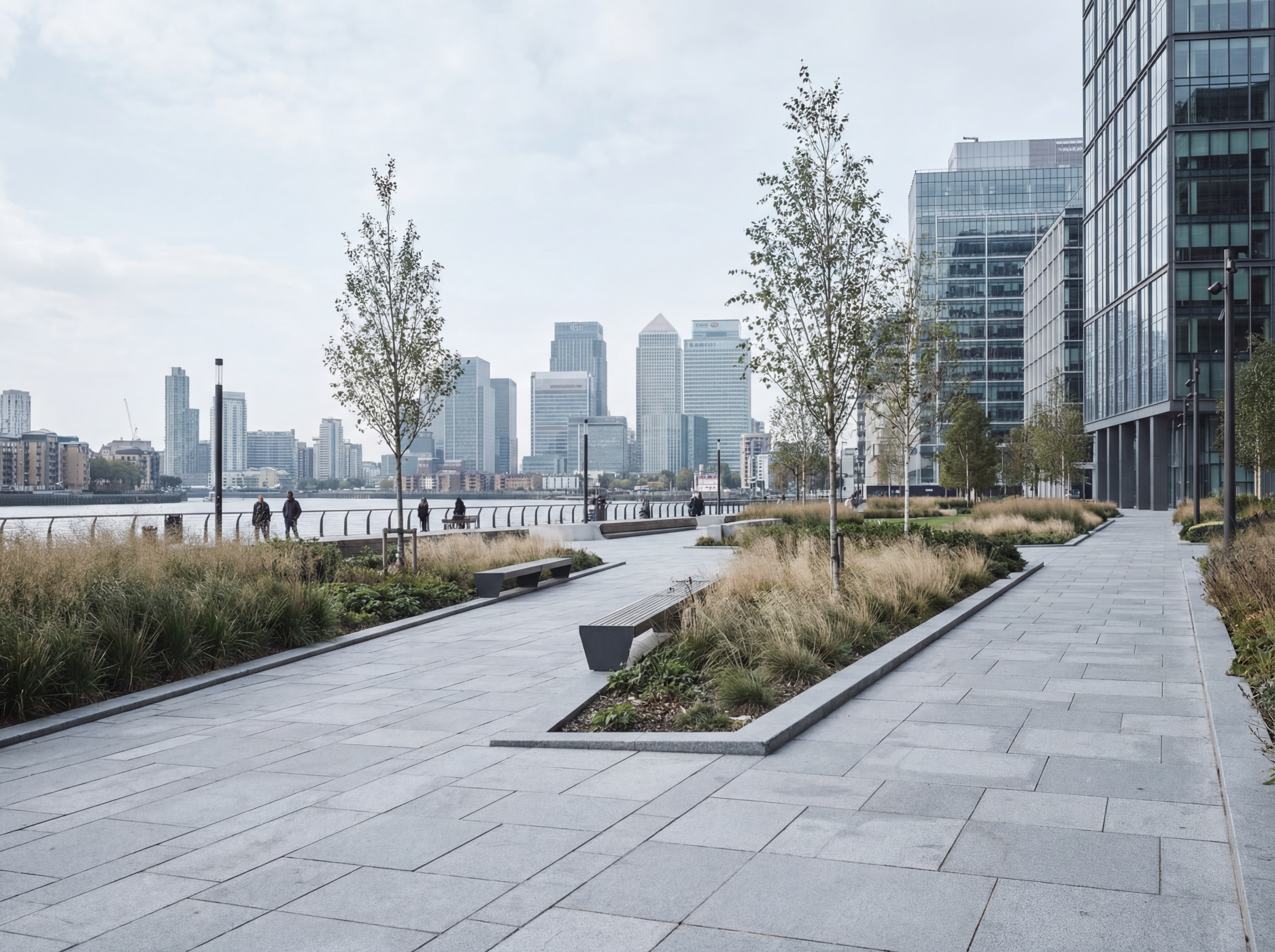 Modern riverside promenade with city skyline
