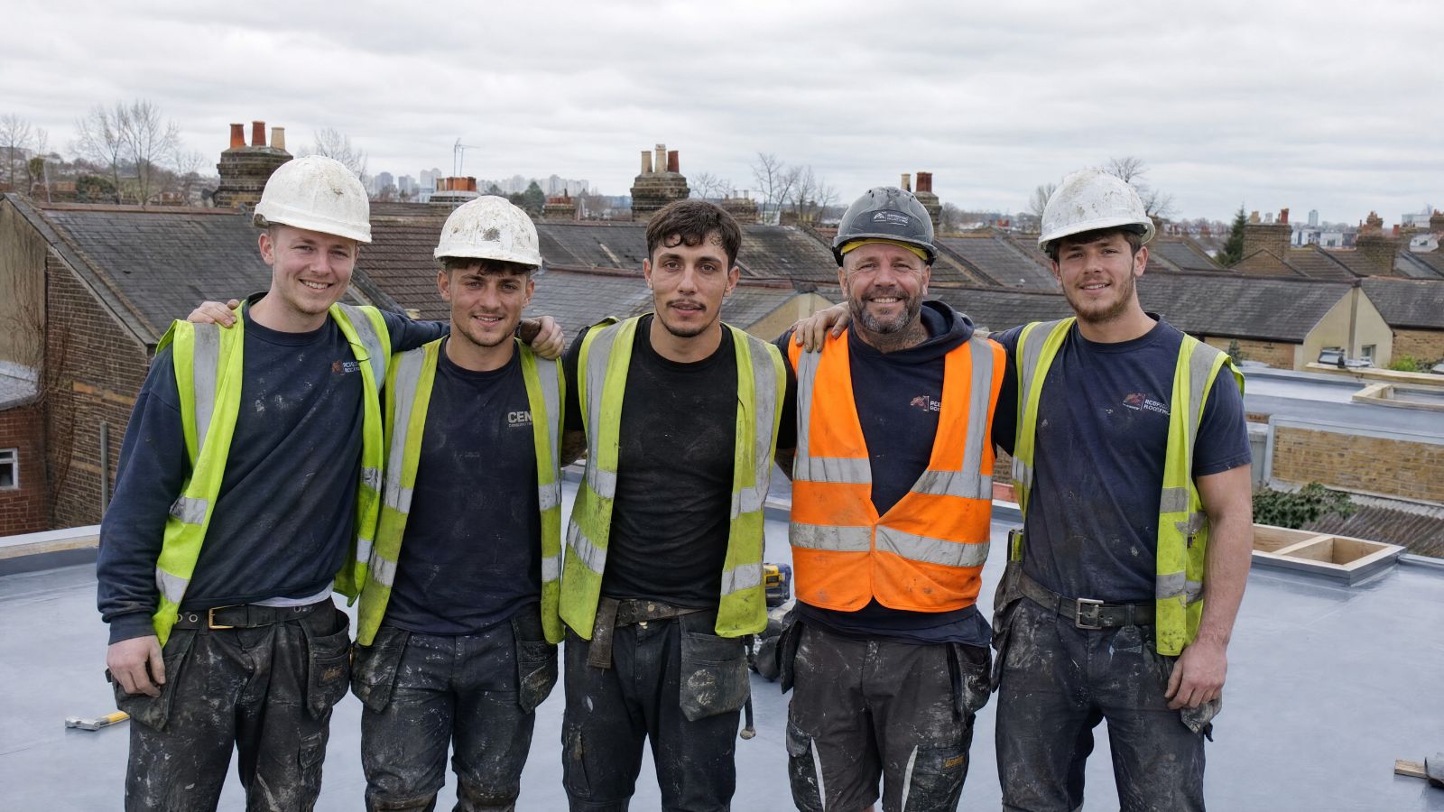 Professional roofing team working in SW London
