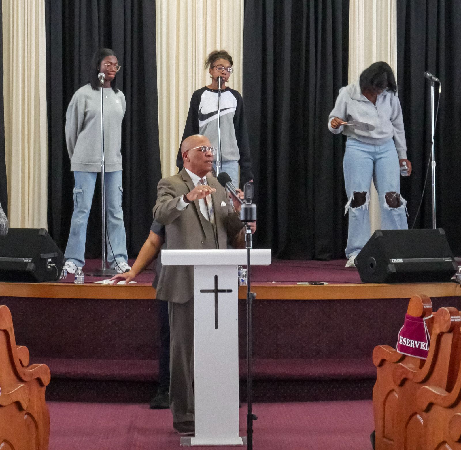 Pastor teaching from the Bible during a service