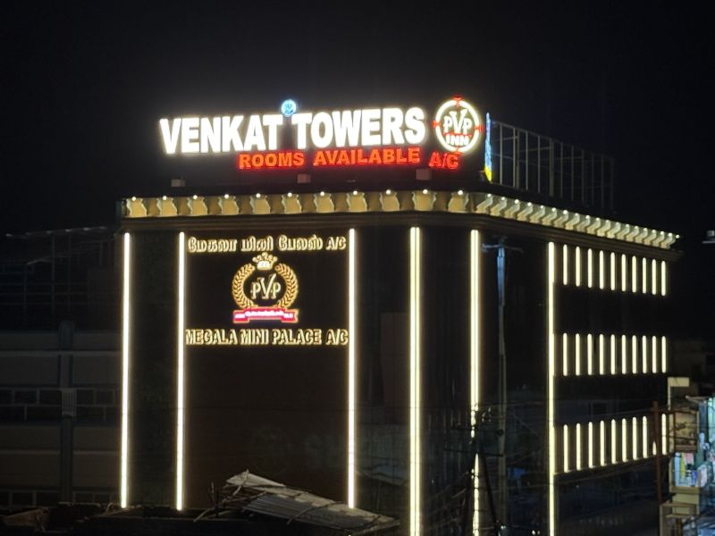 Bright, neatly arranged bed with white linens
