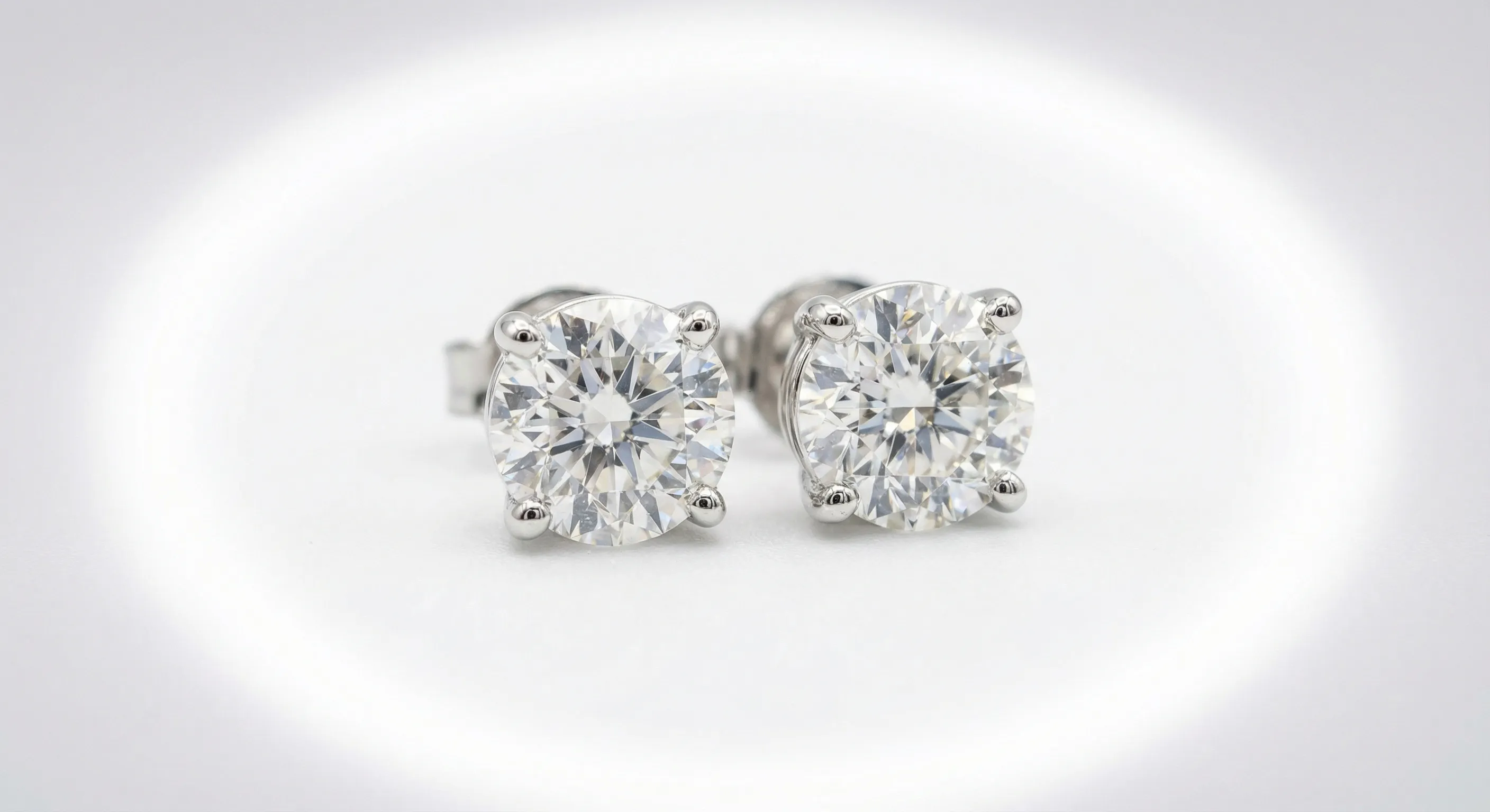 Diamond stud earrings on white background