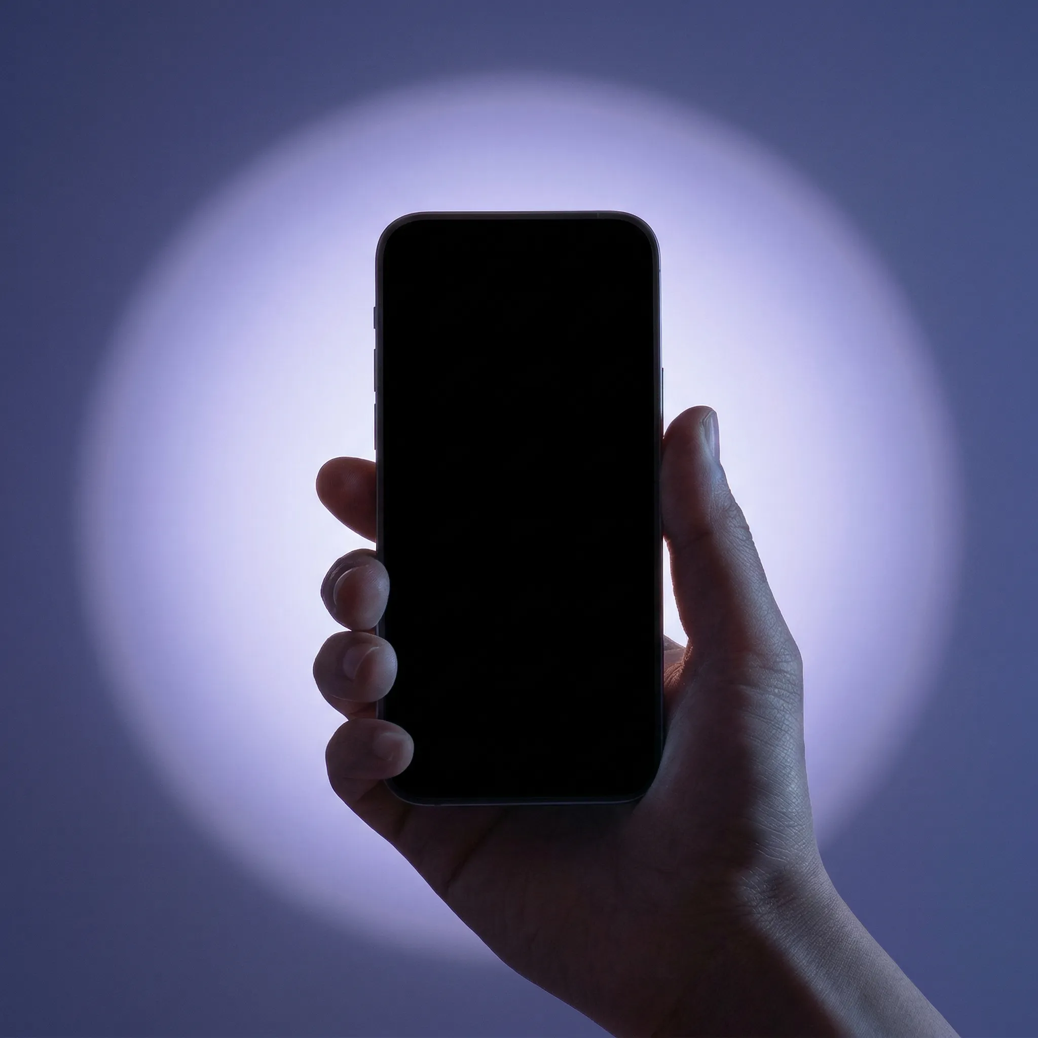 Hand Holding Smartphone in Blue Spotlight