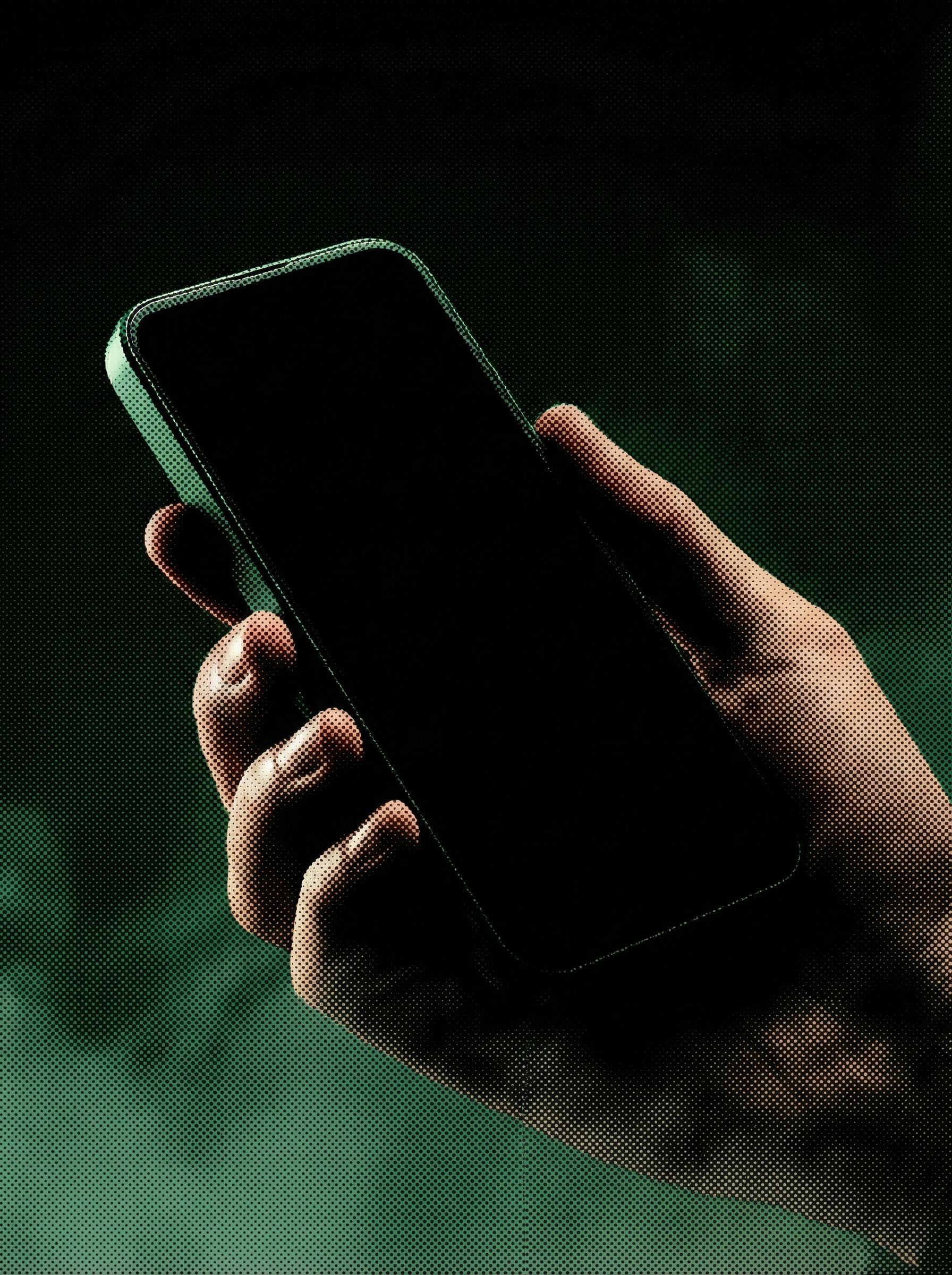 Hand Holding Smartphone in Dark Green Light