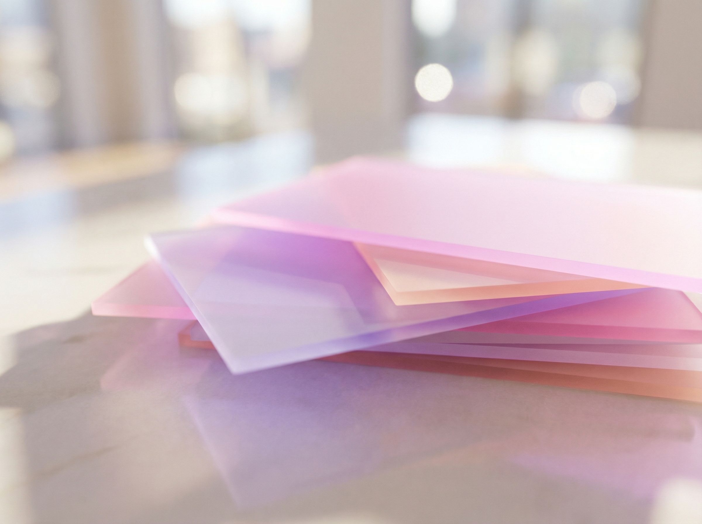 Pastel translucent acrylic sheets on table