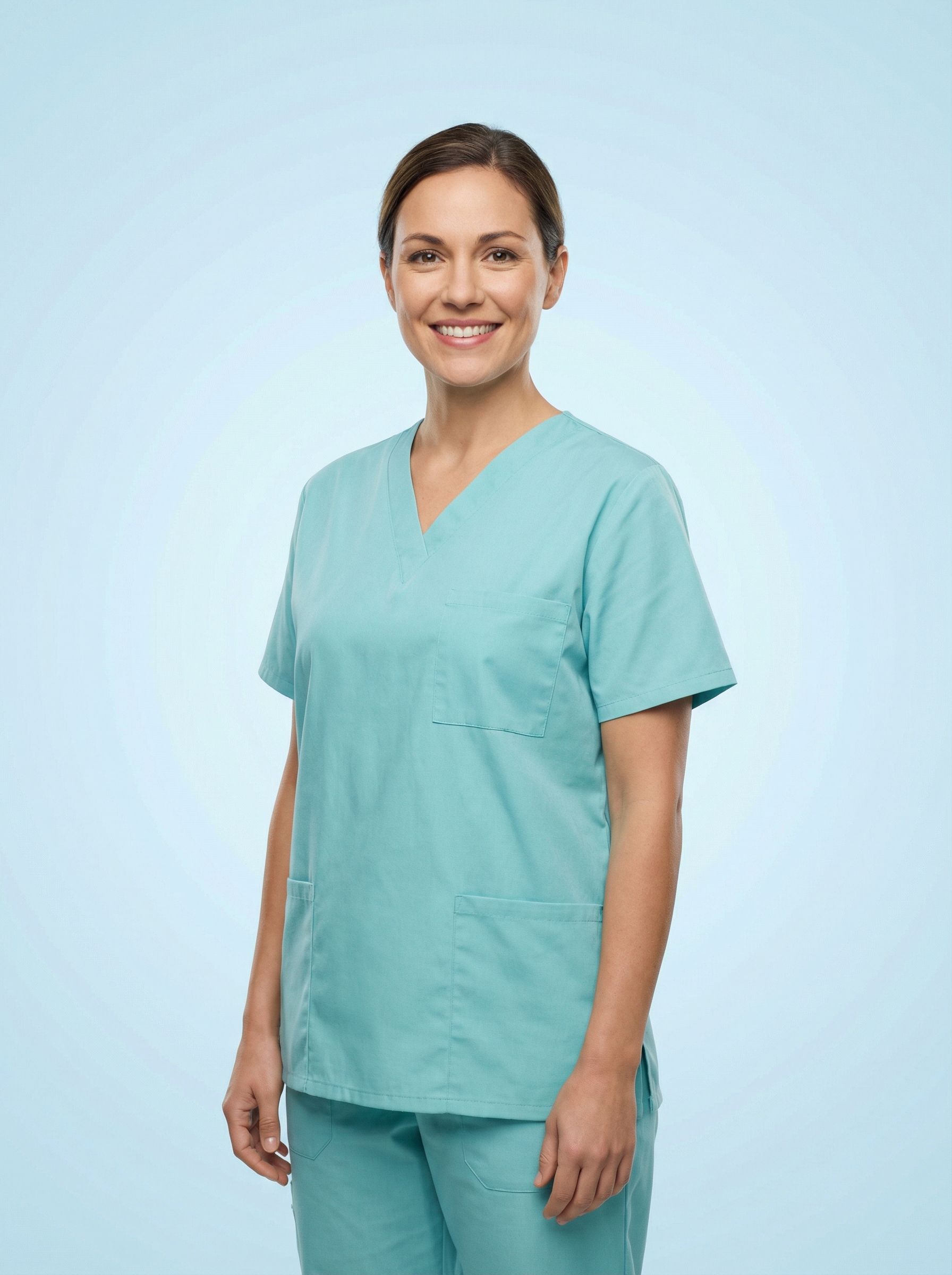 Smiling medical professional in teal scrubs
