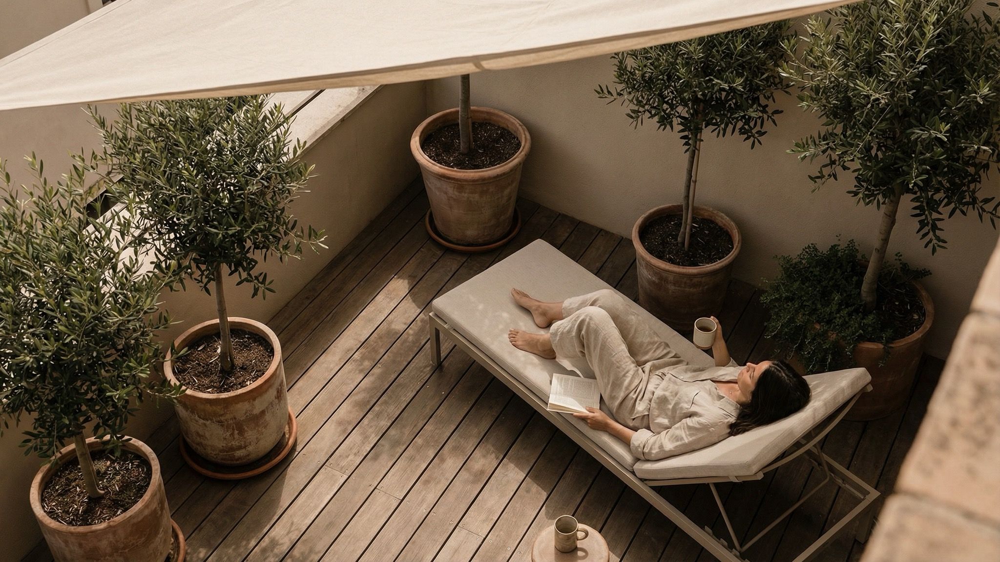 Woman relaxing on minimalist terrace lounge