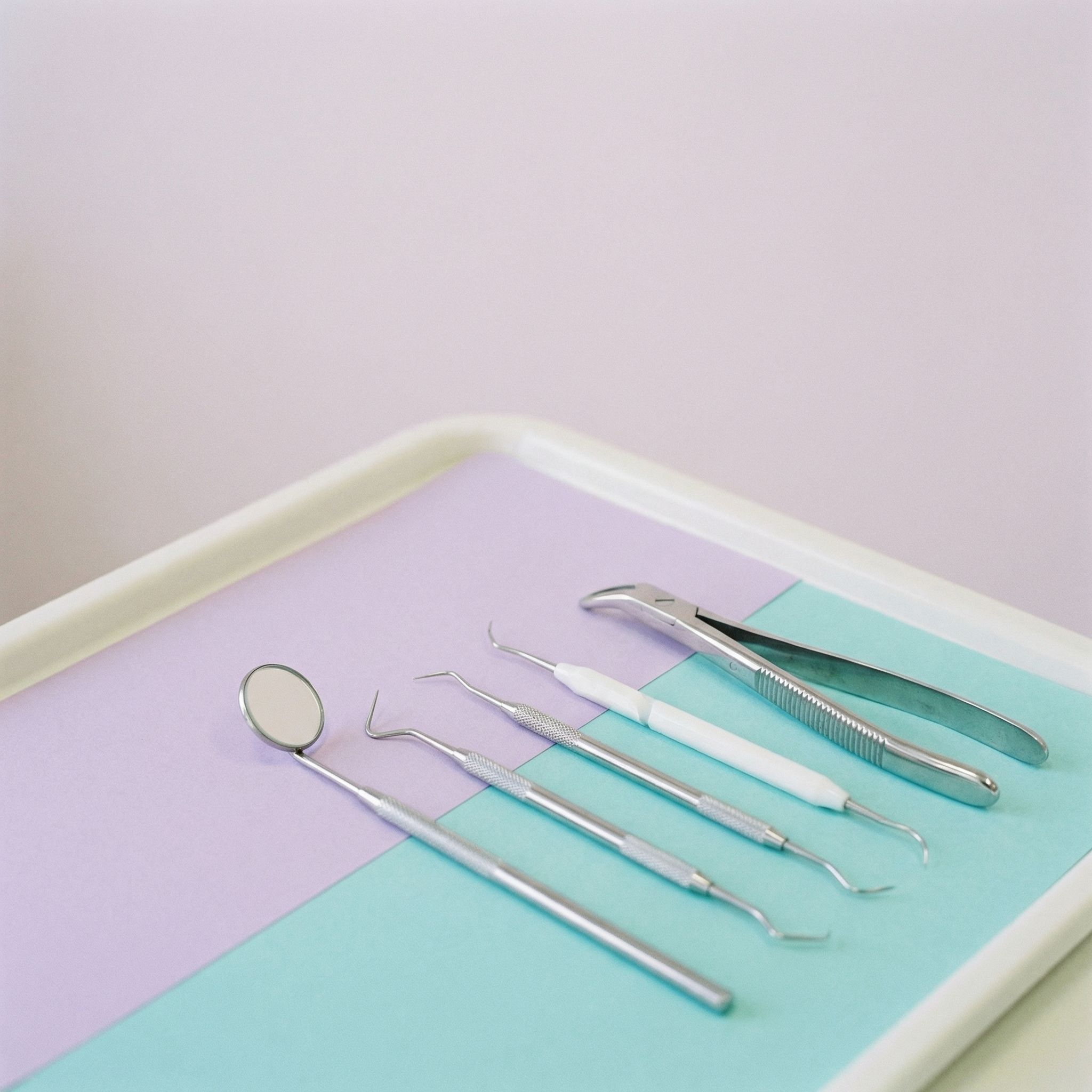 Sterile Dental Instruments on Pastel Tray