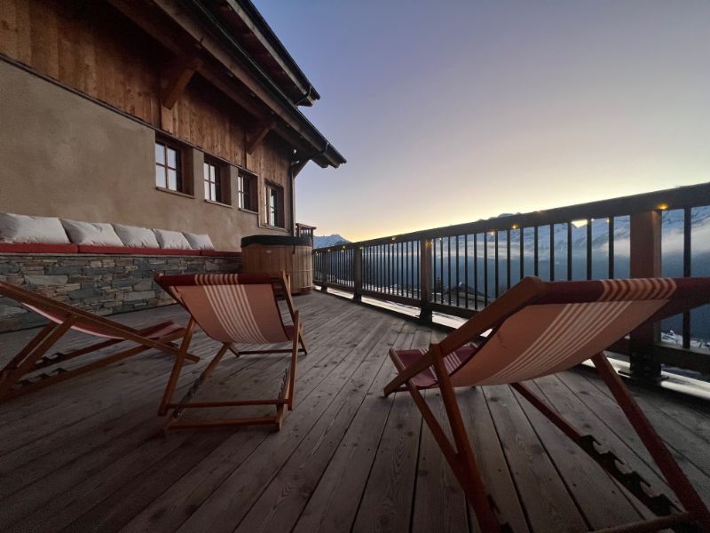 Alpine Chalet Terrace at Sunset