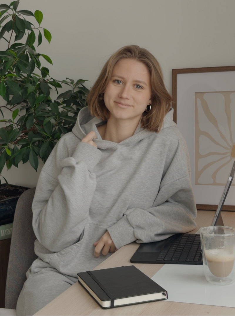 Woman in Gray Hoodie at Desk