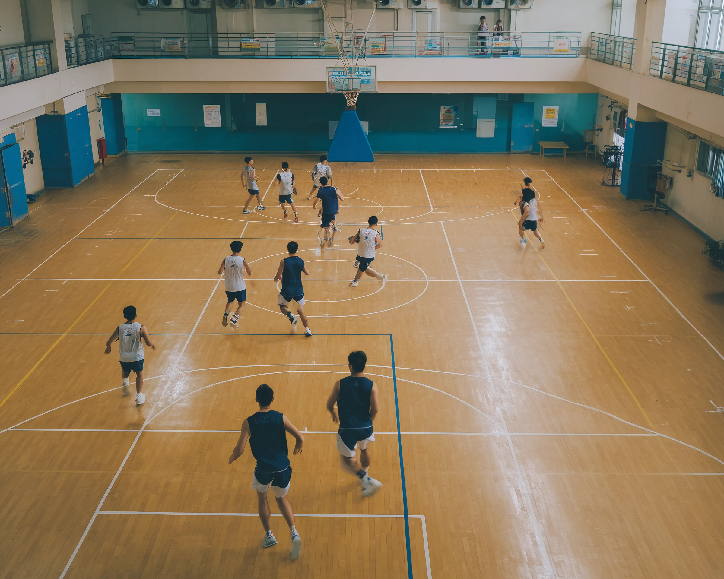 Students Playing Basketball in Indoor Gym