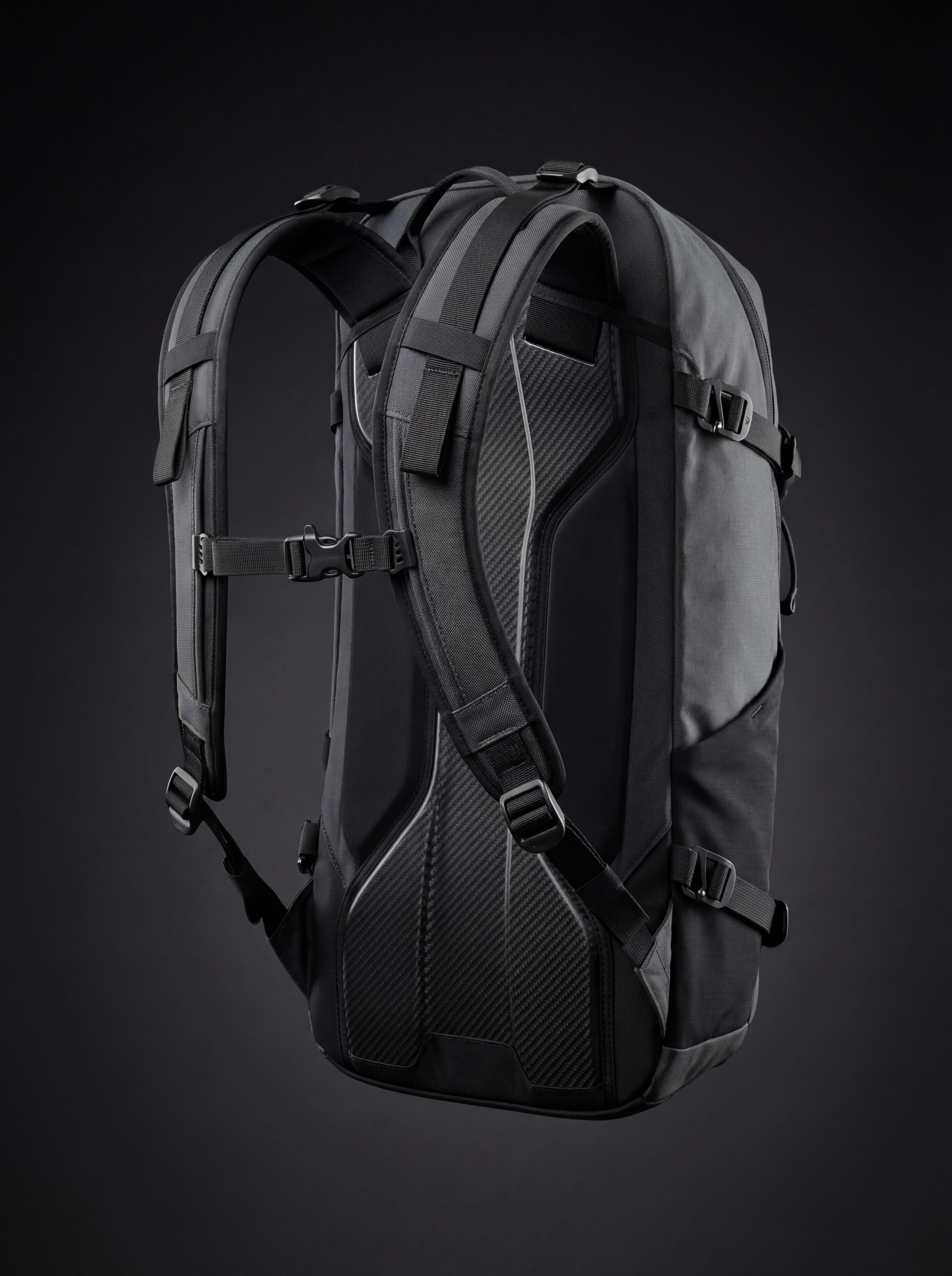 Black technical backpack on dark background
