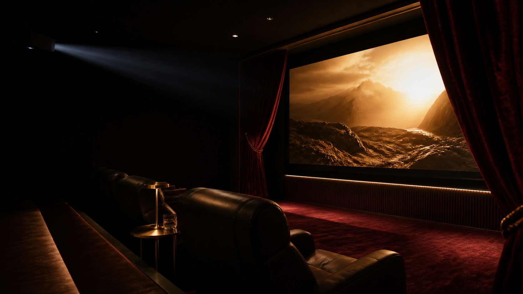 An intimate private screening suite with velvet curtains, leather recliners and a glowing cinema screen