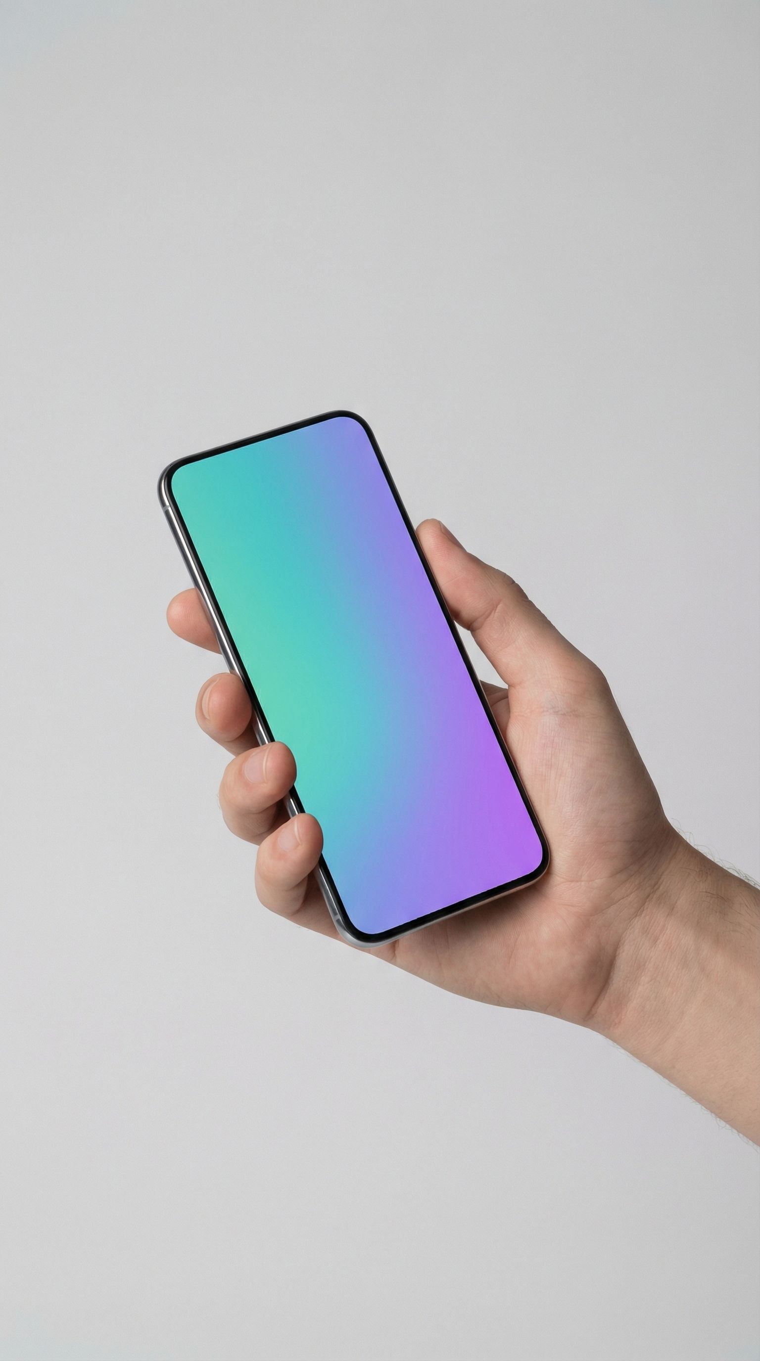 Hand holding smartphone with gradient screen