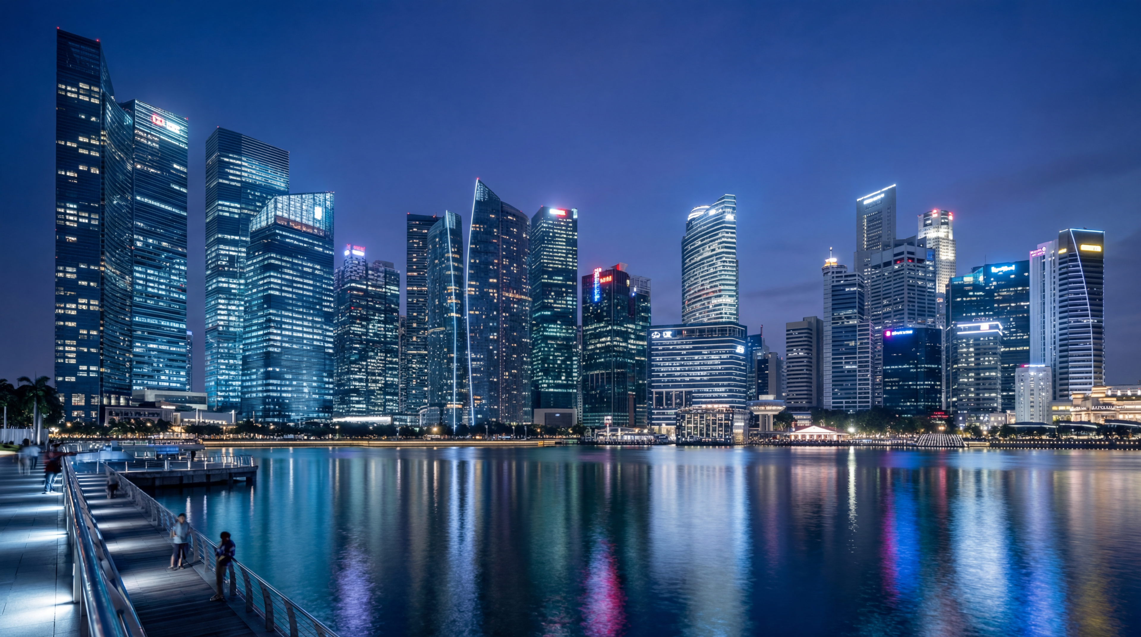 Modern city skyline at night by the waterfront
