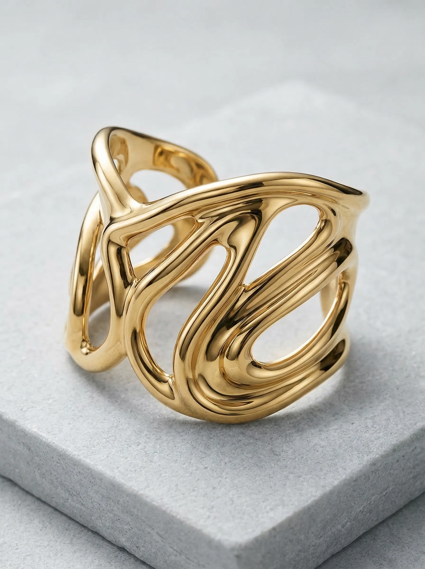 Abstract Gold Statement Ring on Stone Block