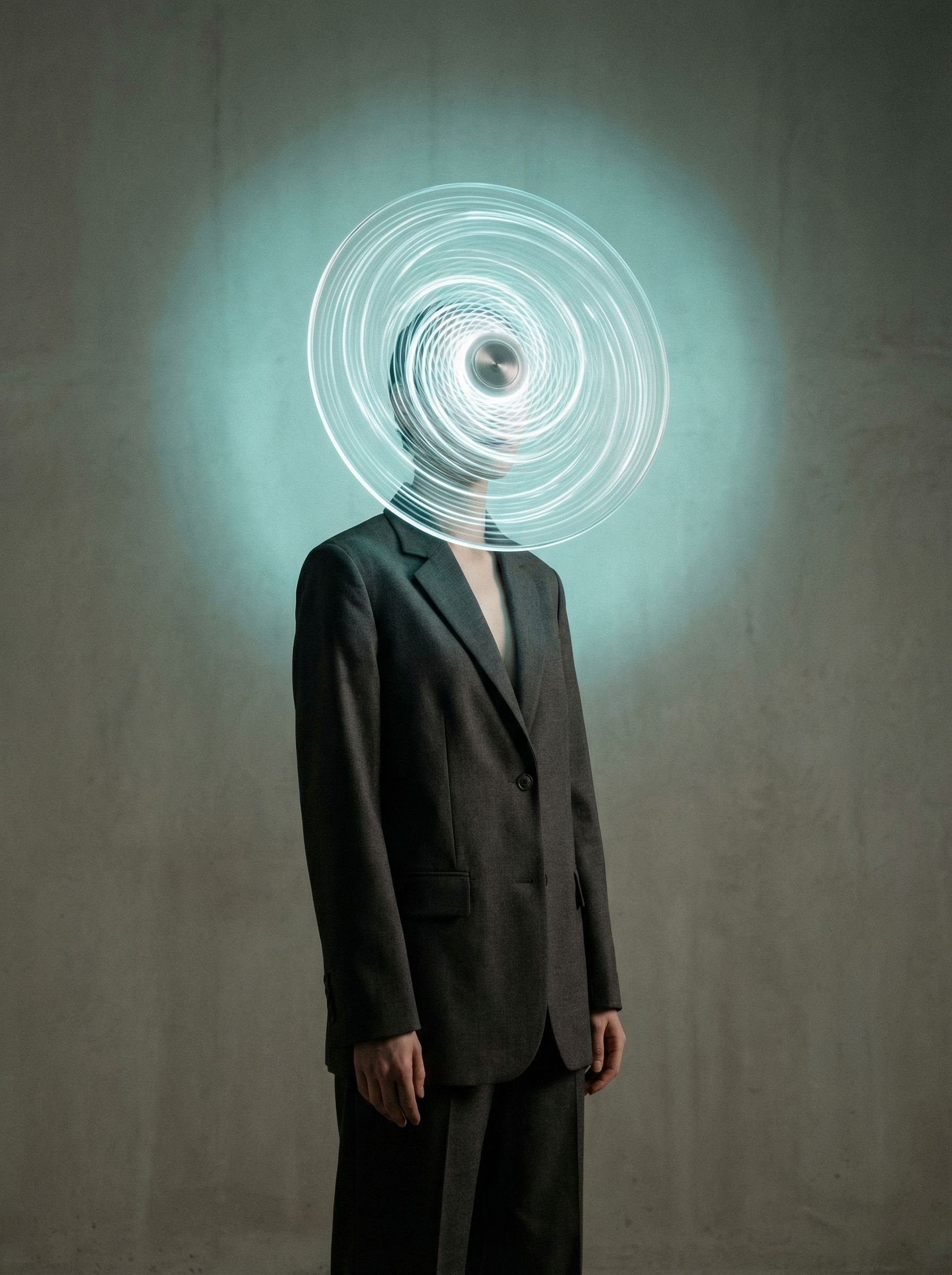 Surreal portrait with glowing spiral head