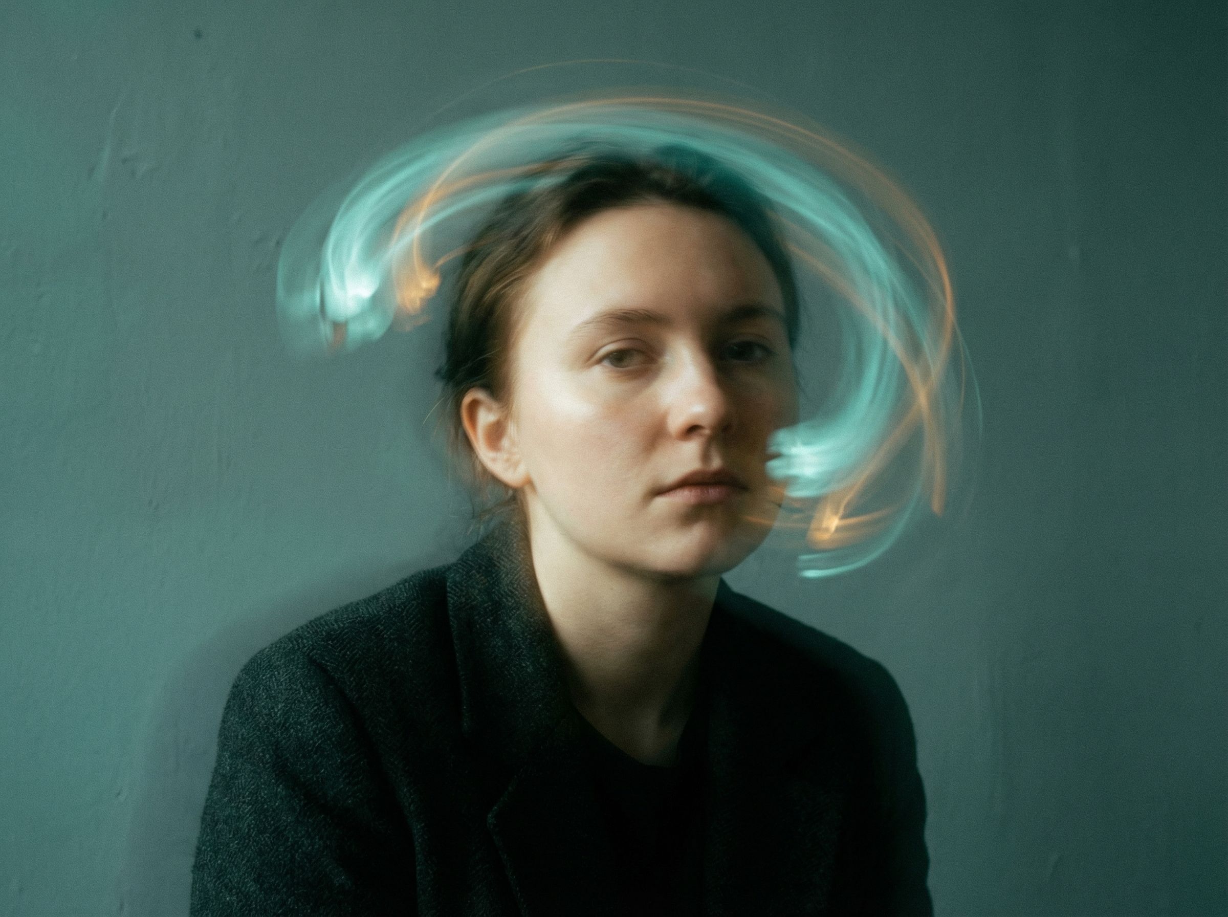 Moody portrait with swirling light trails