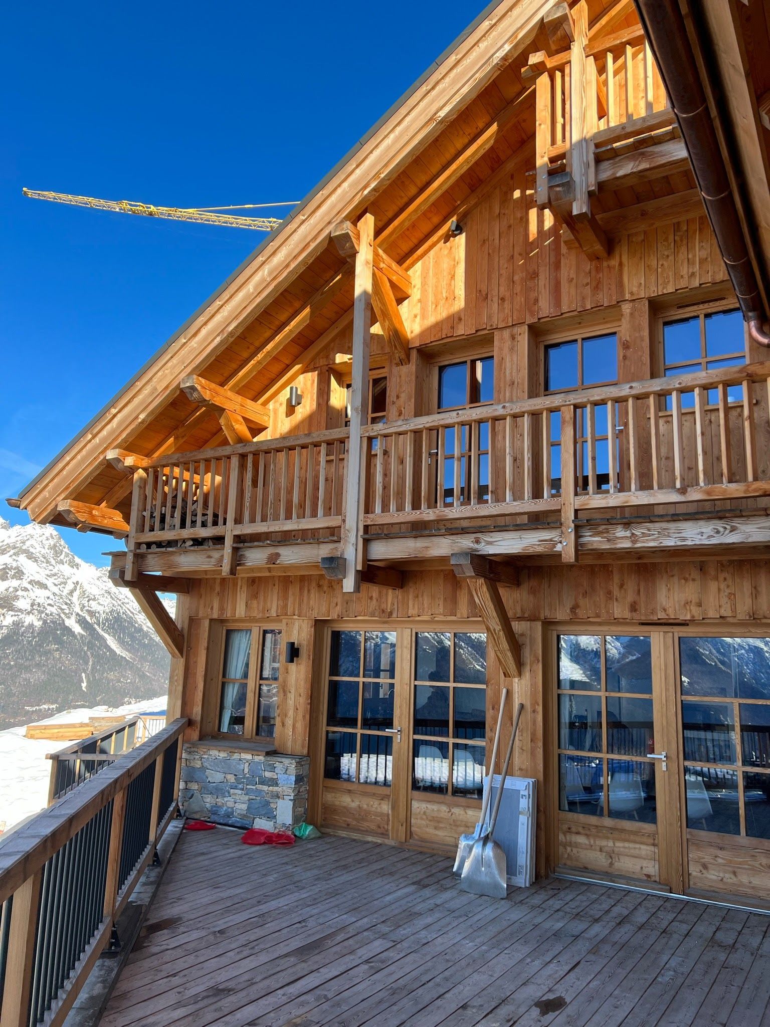 Modern Alpine Wooden Chalet in the Snow