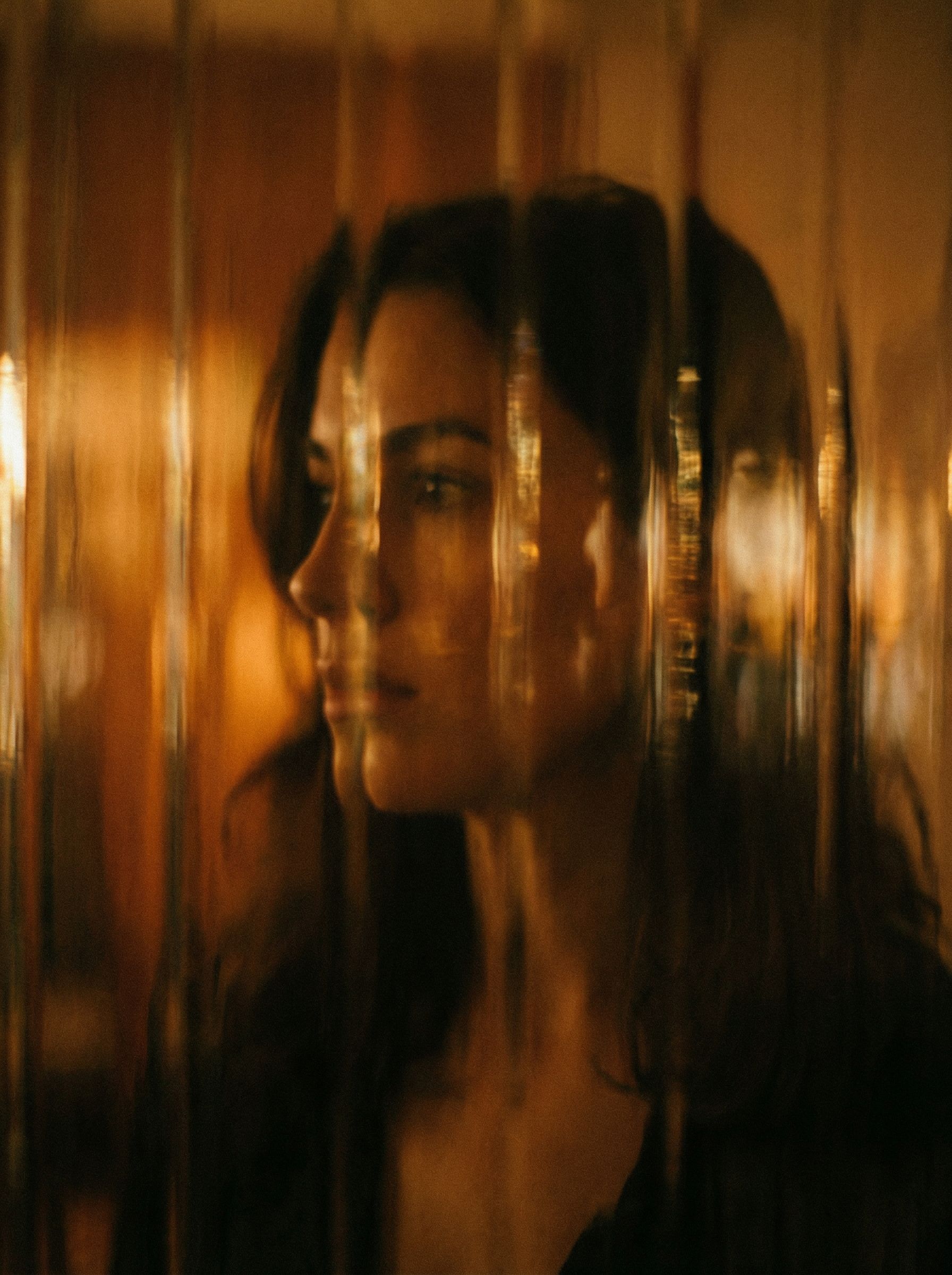 Abstract portrait behind textured glass