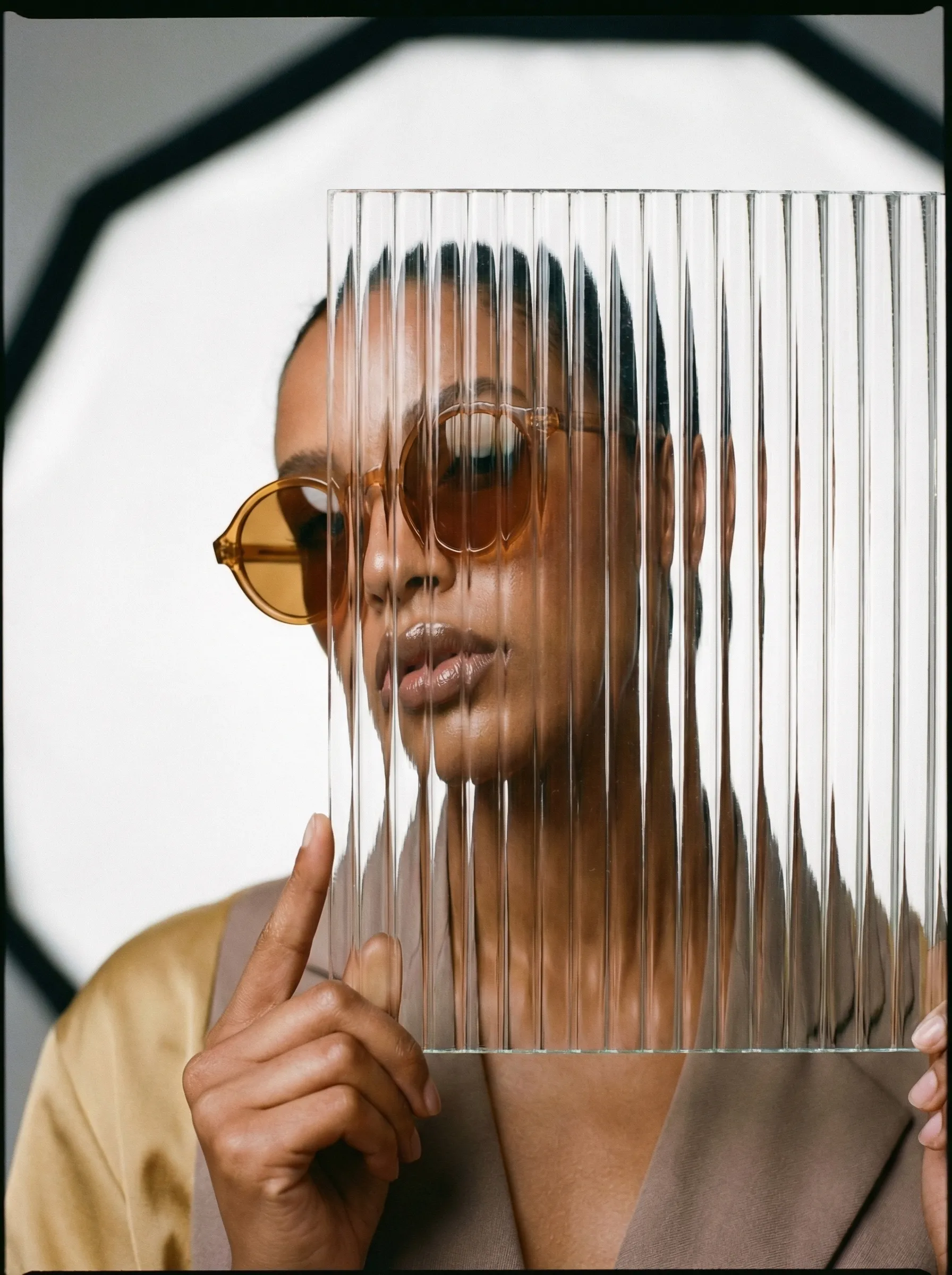 Portrait with ribbed glass and amber sunglasses