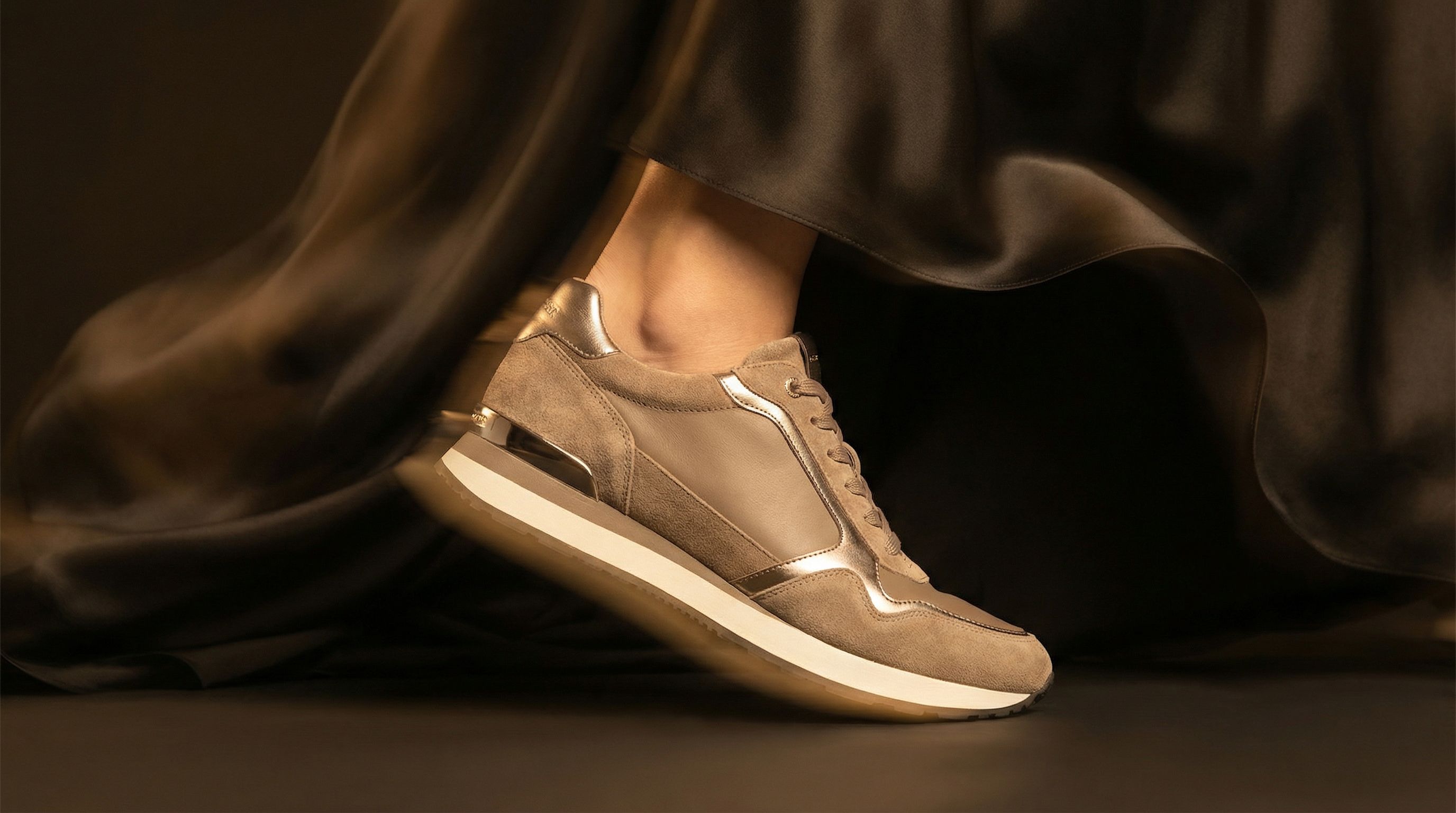 Luxury beige sneaker with metallic accents