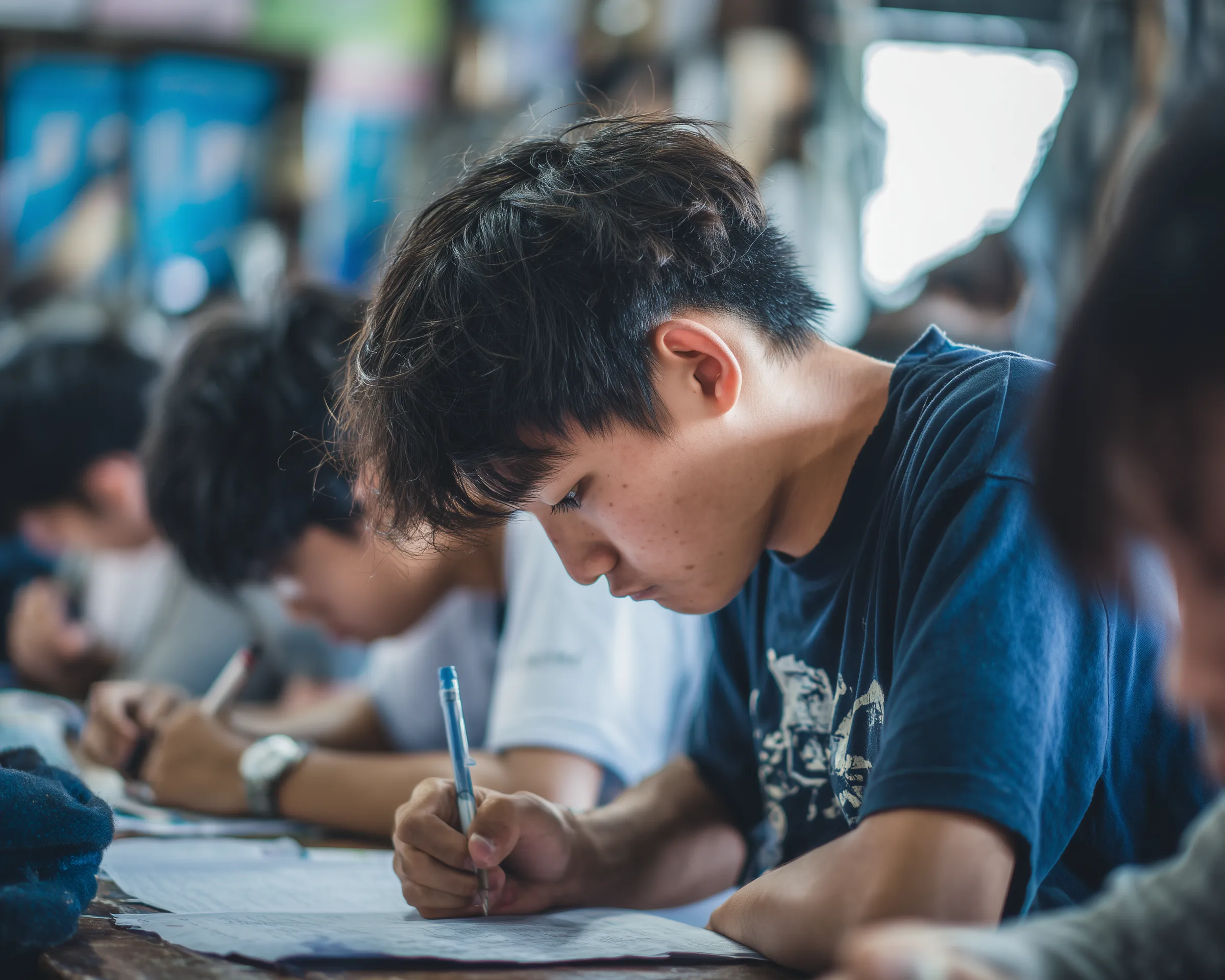 Students Focused on Writing in Classroom