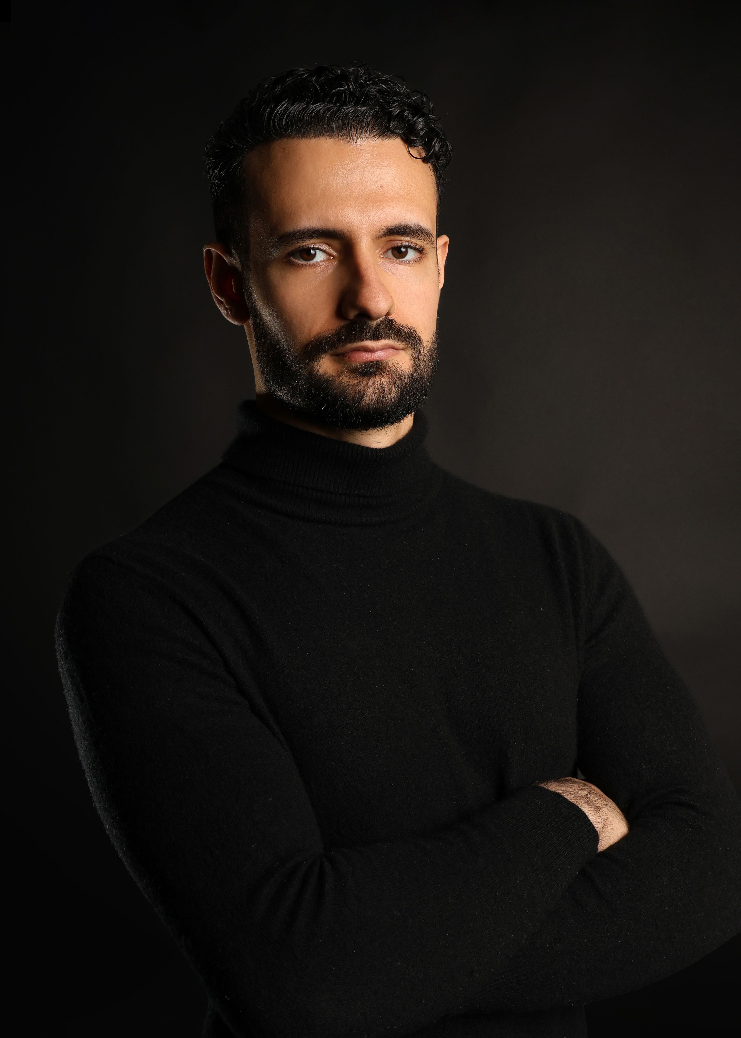 Moody Low-Key Portrait of Man in Black Turtleneck
