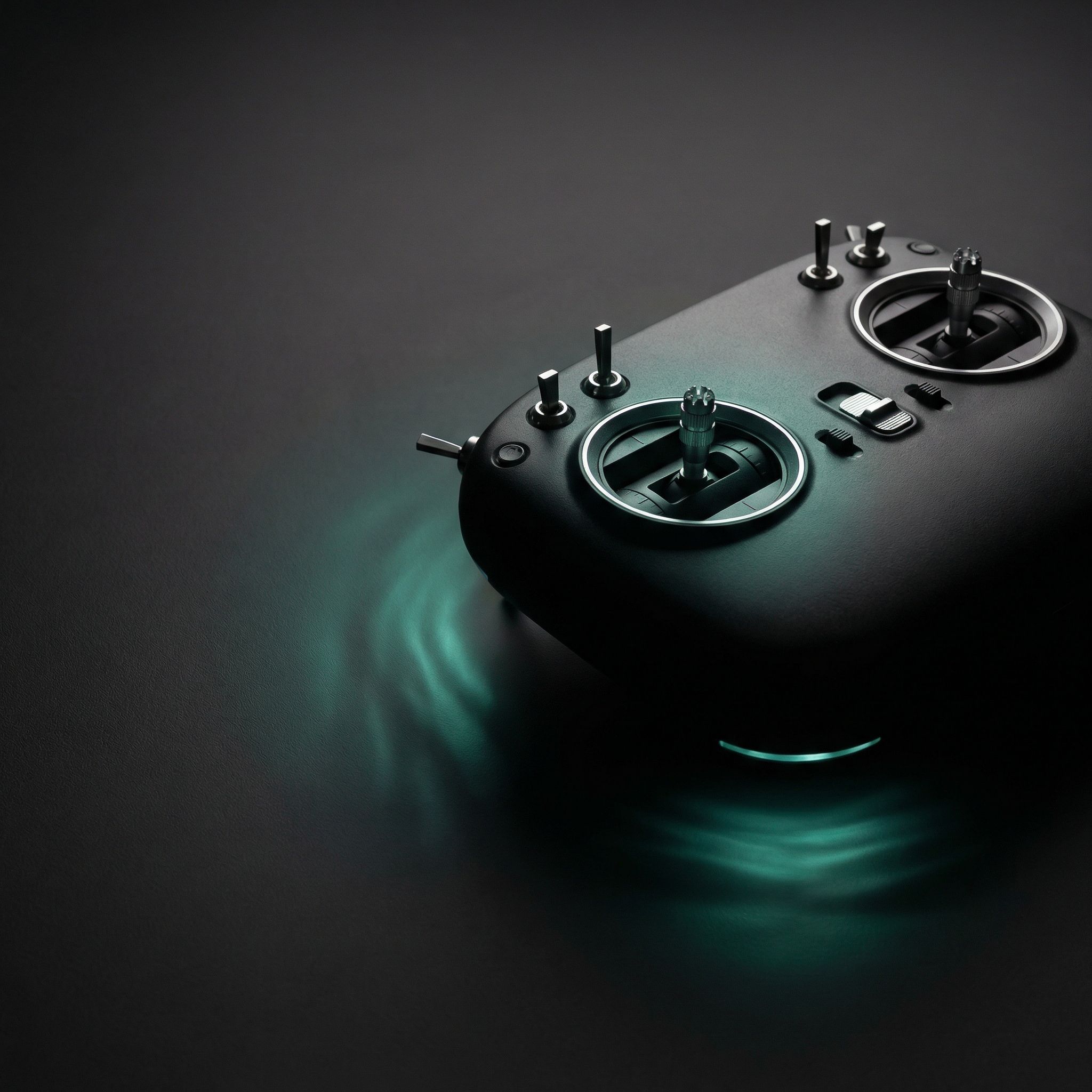Futuristic remote controller with teal glow
