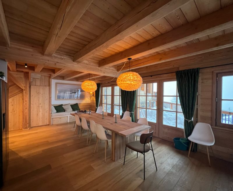 Rustic Wooden Chalet Dining Room with Snowy View