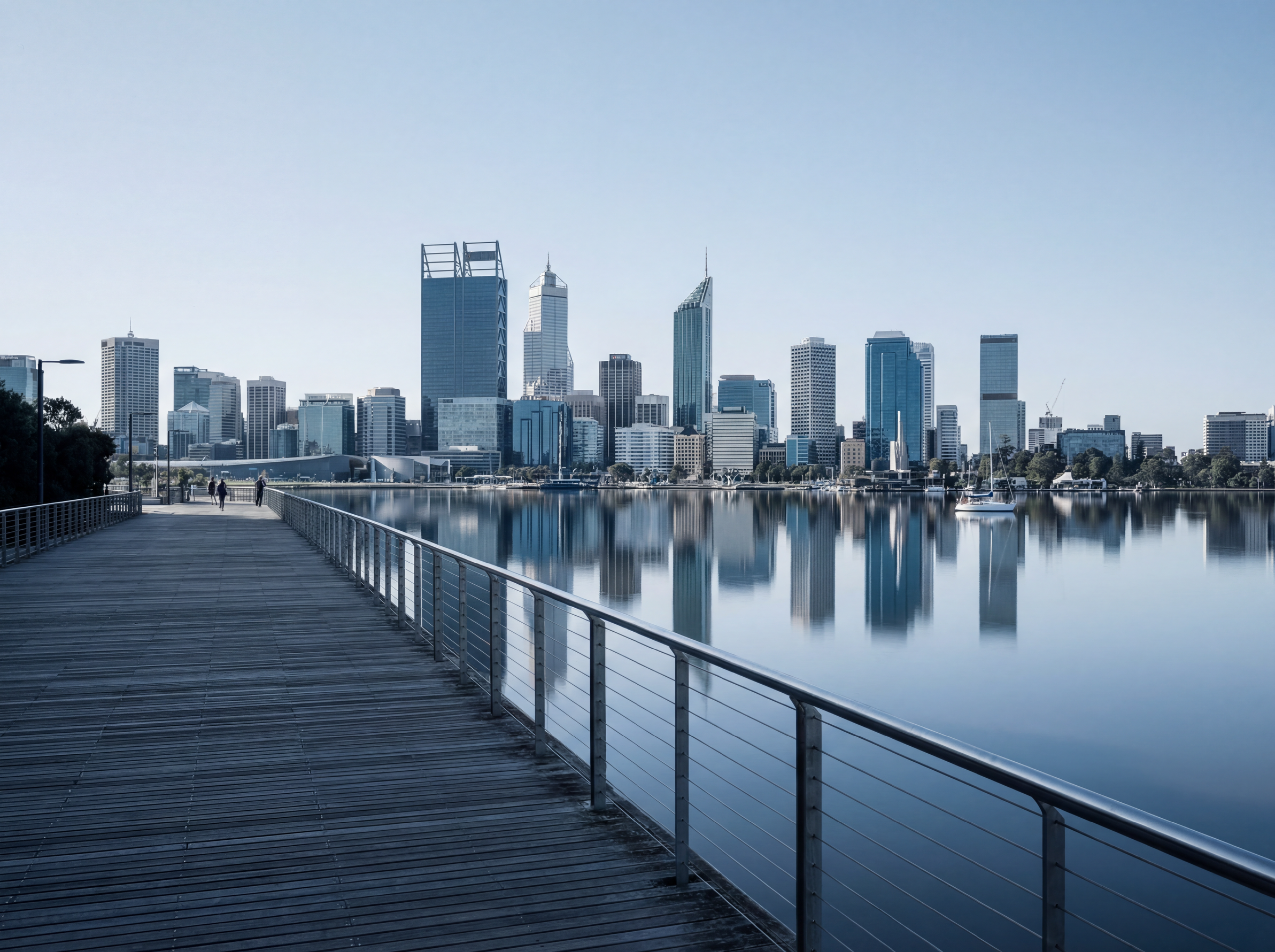 Waterfront boardwalk overlooking modern skyline