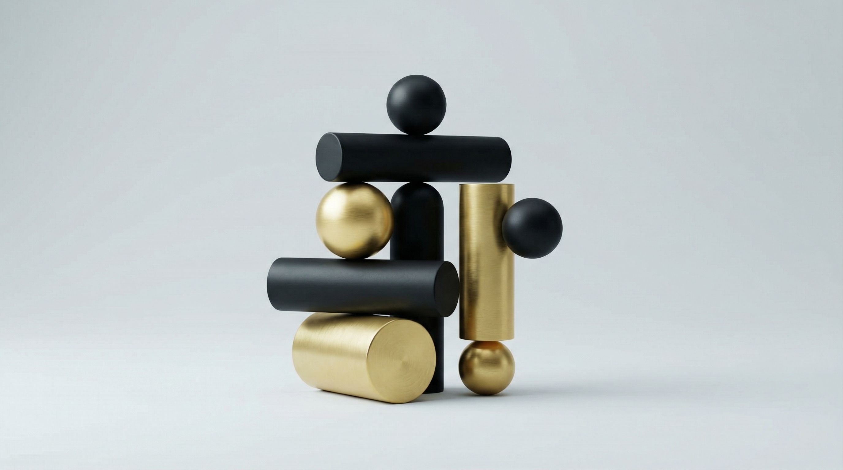 Black and gold geometric sculpture on grey
