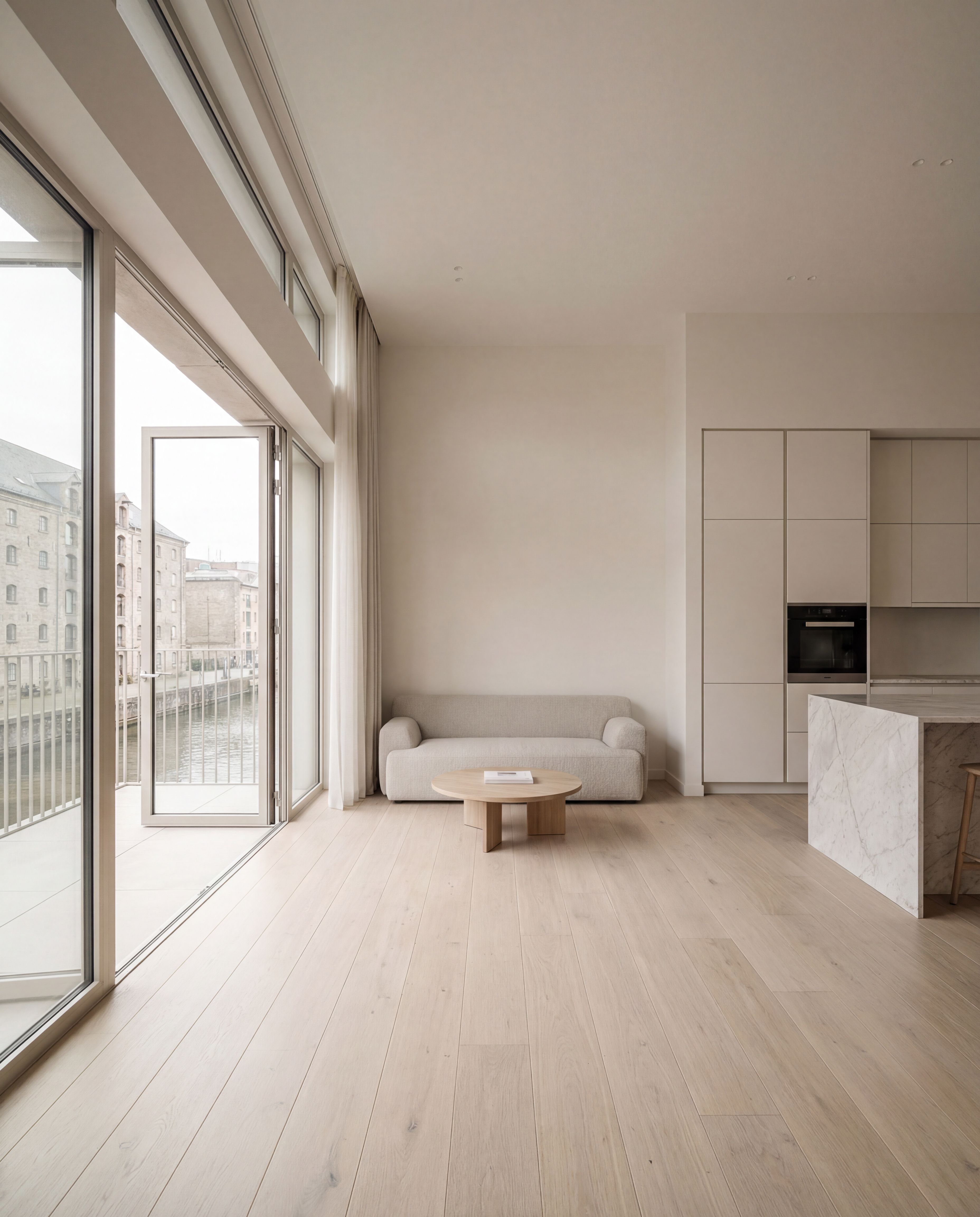 Minimalist neutral living room with large windows
