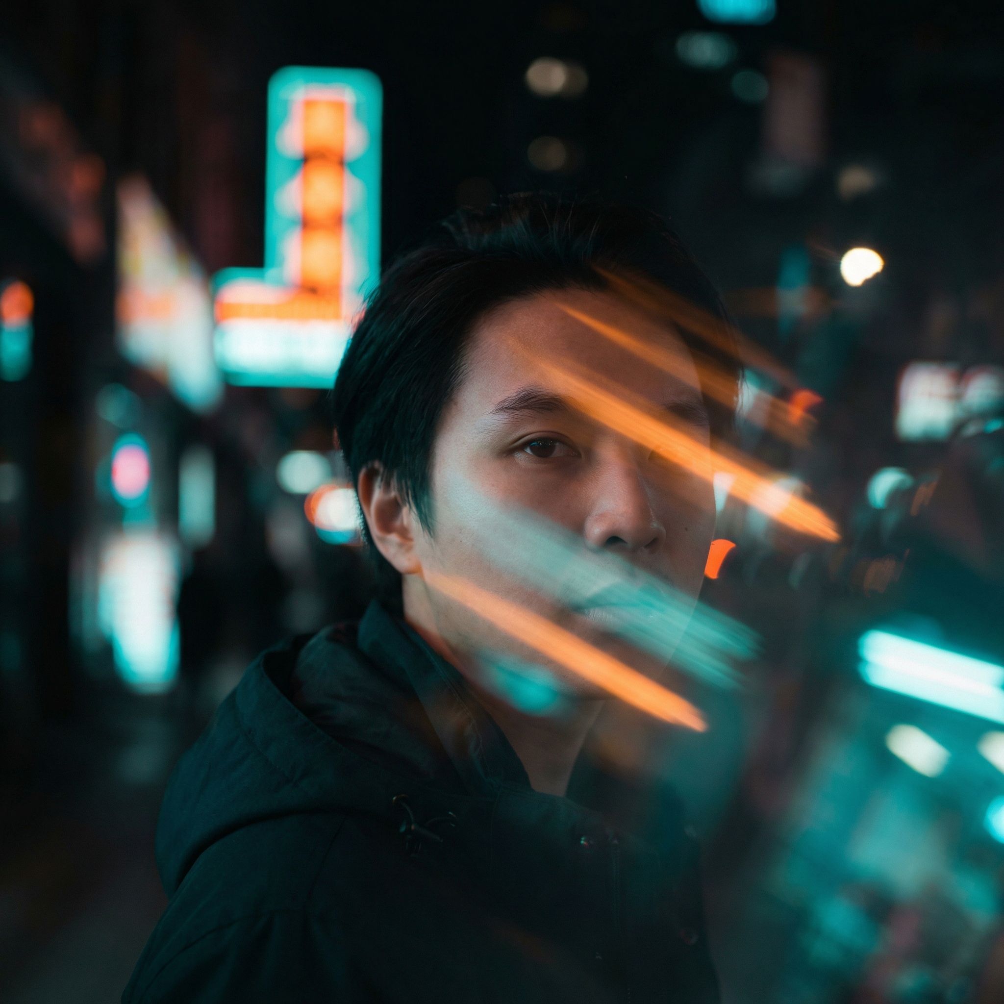 Moody portrait in neon city lights
