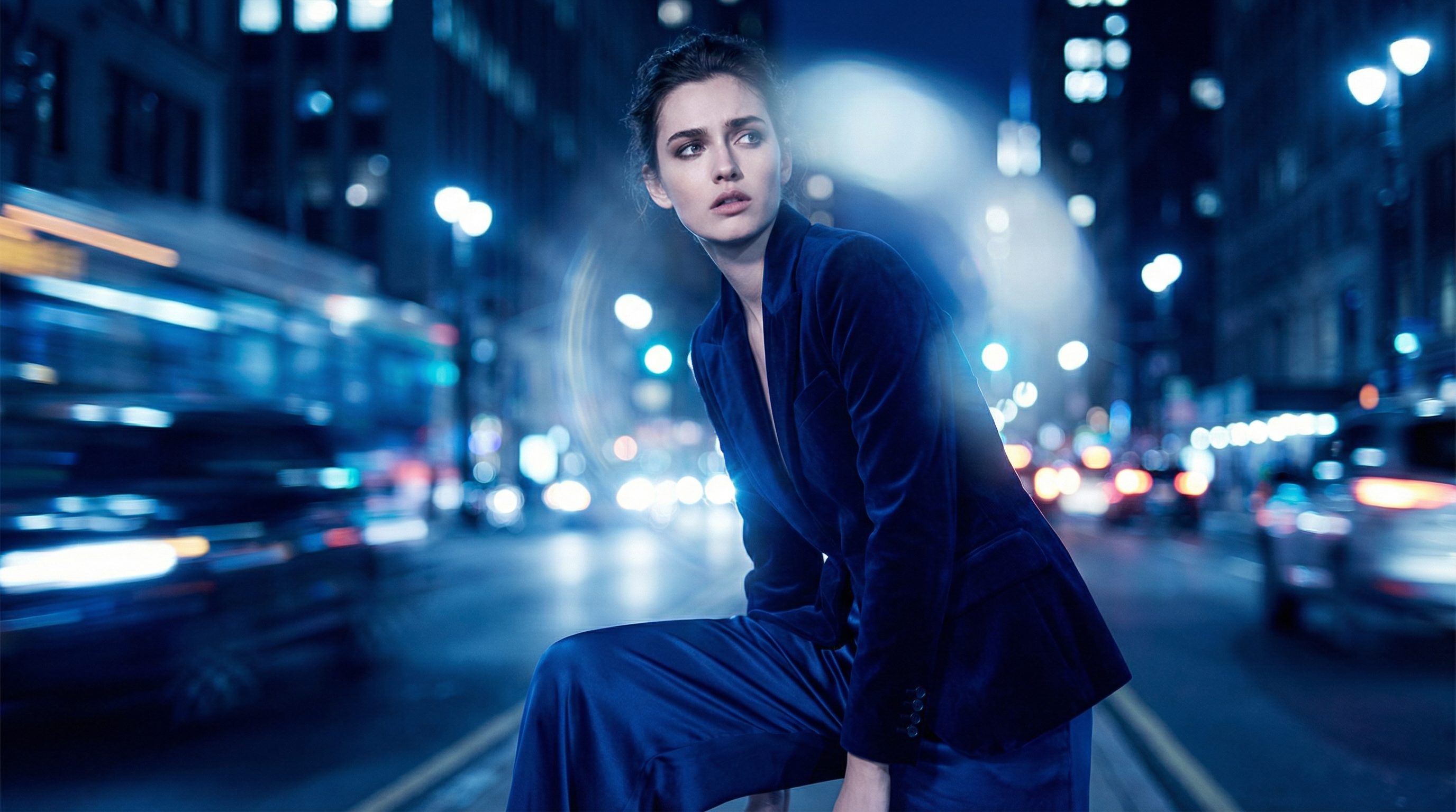Fashion portrait in neon-lit city street