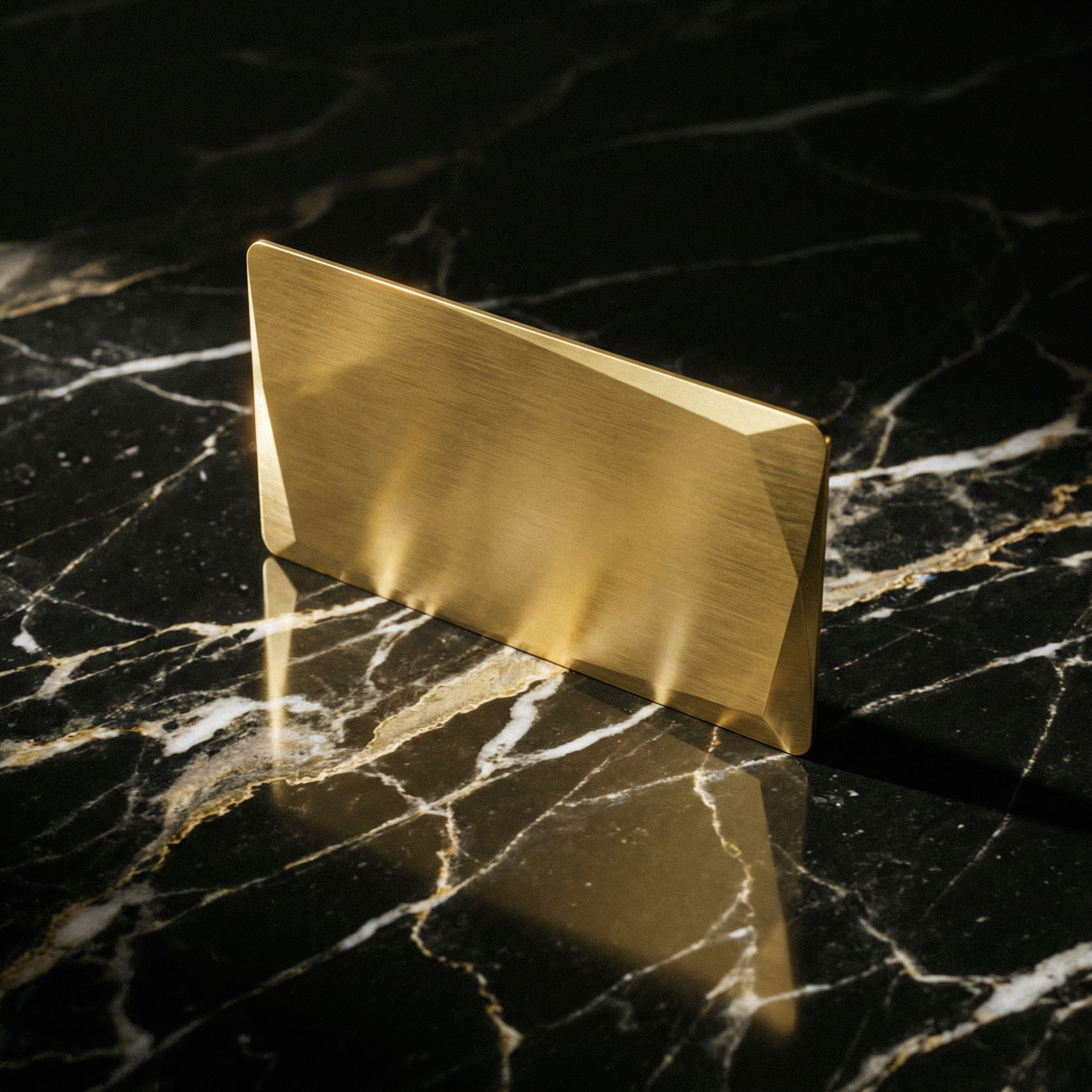 Gold Metal Plate on Black Marble Surface