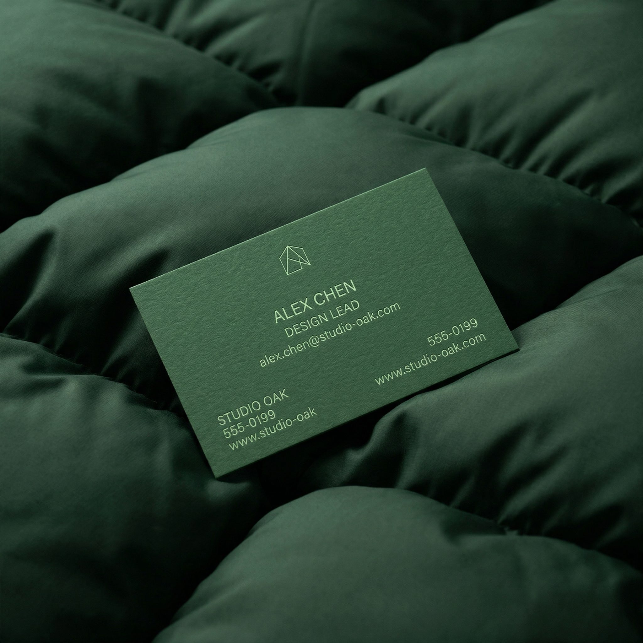 Green Business Card Mockup on Quilted Fabric