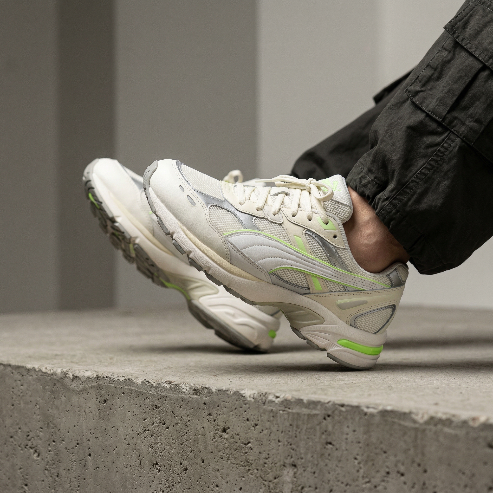 White Running Sneakers on Concrete Step