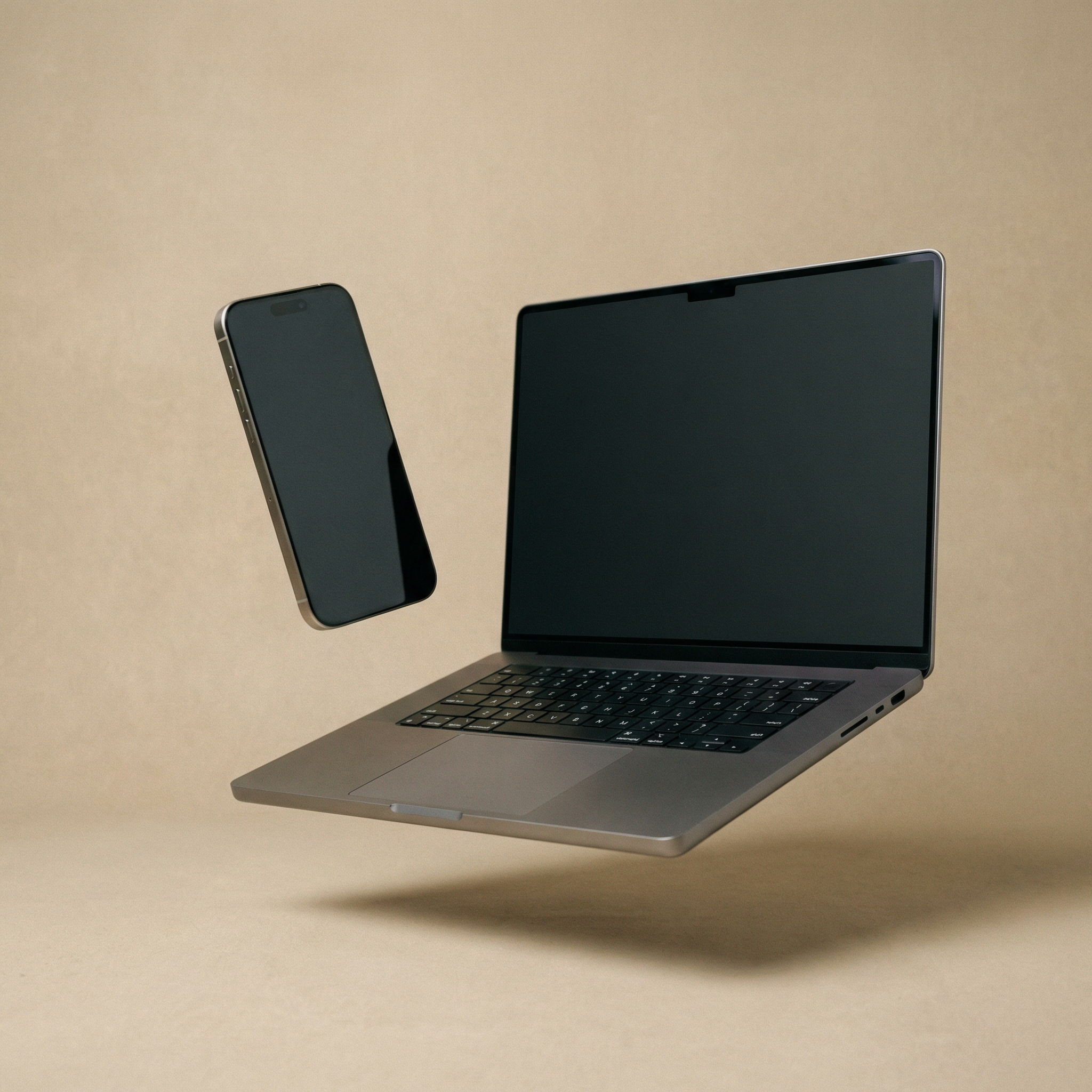 Floating Laptop and Smartphone on Beige Background