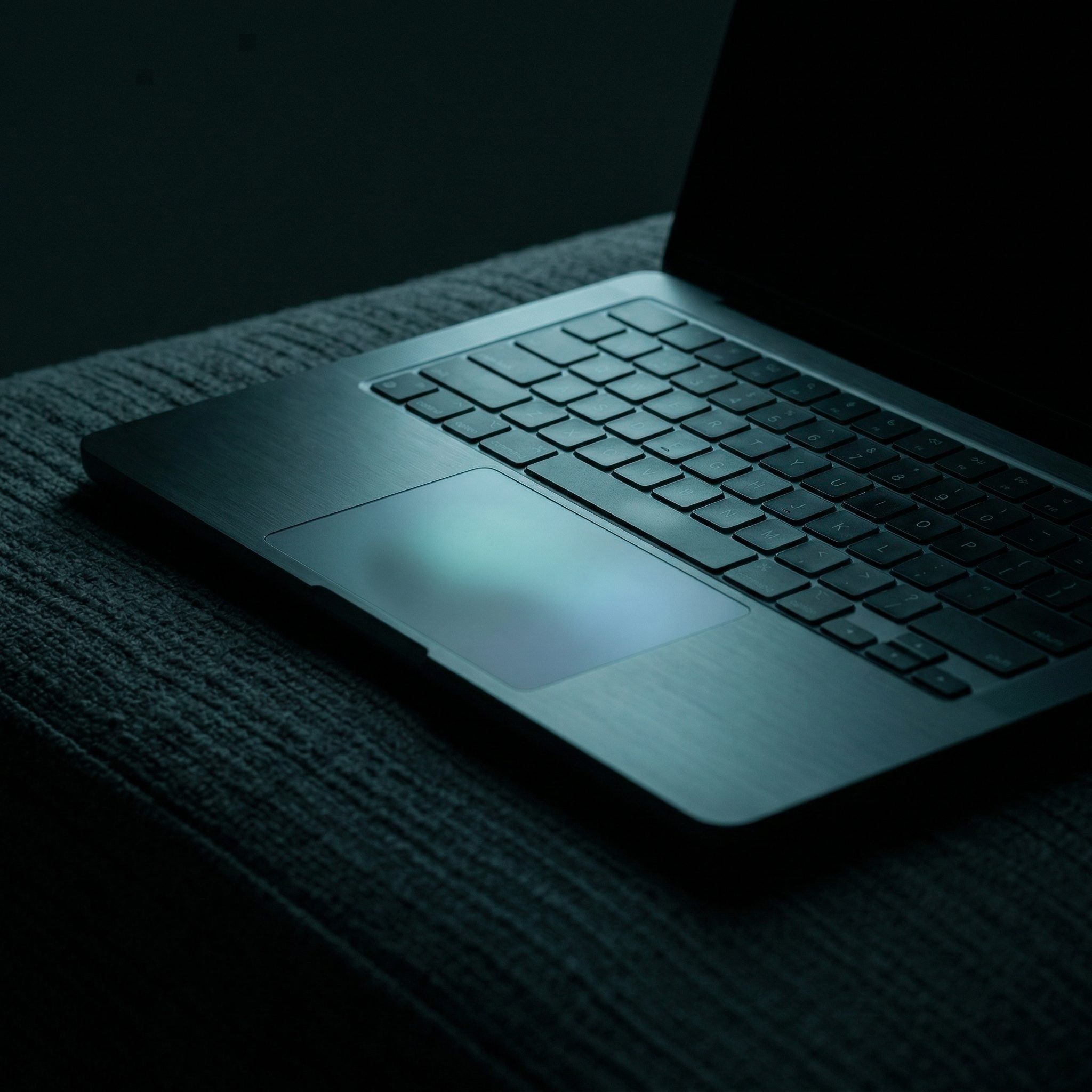 Moody Close-Up of Laptop Keyboard and Trackpad