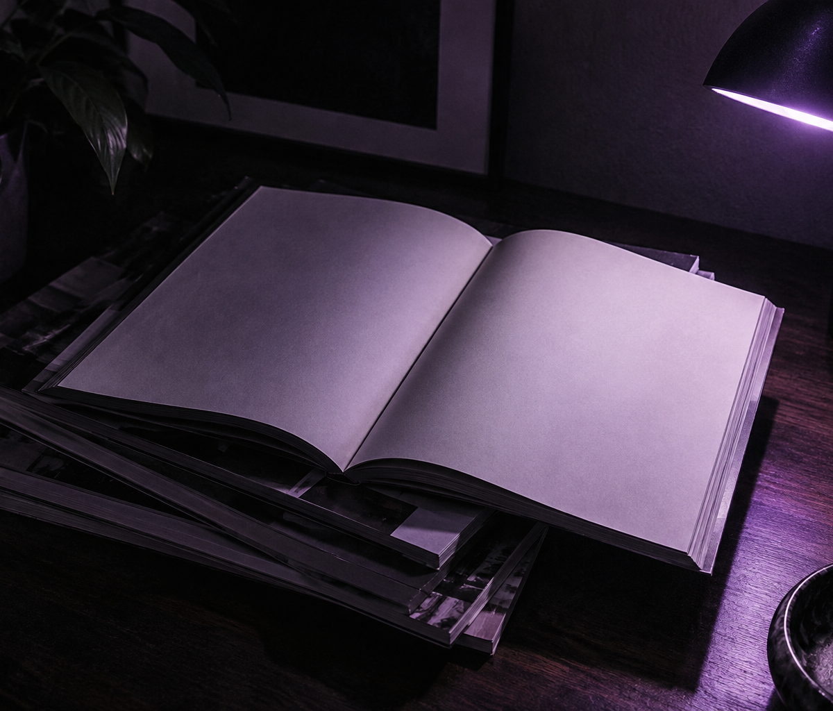 A stack of magazines under a violet lamp